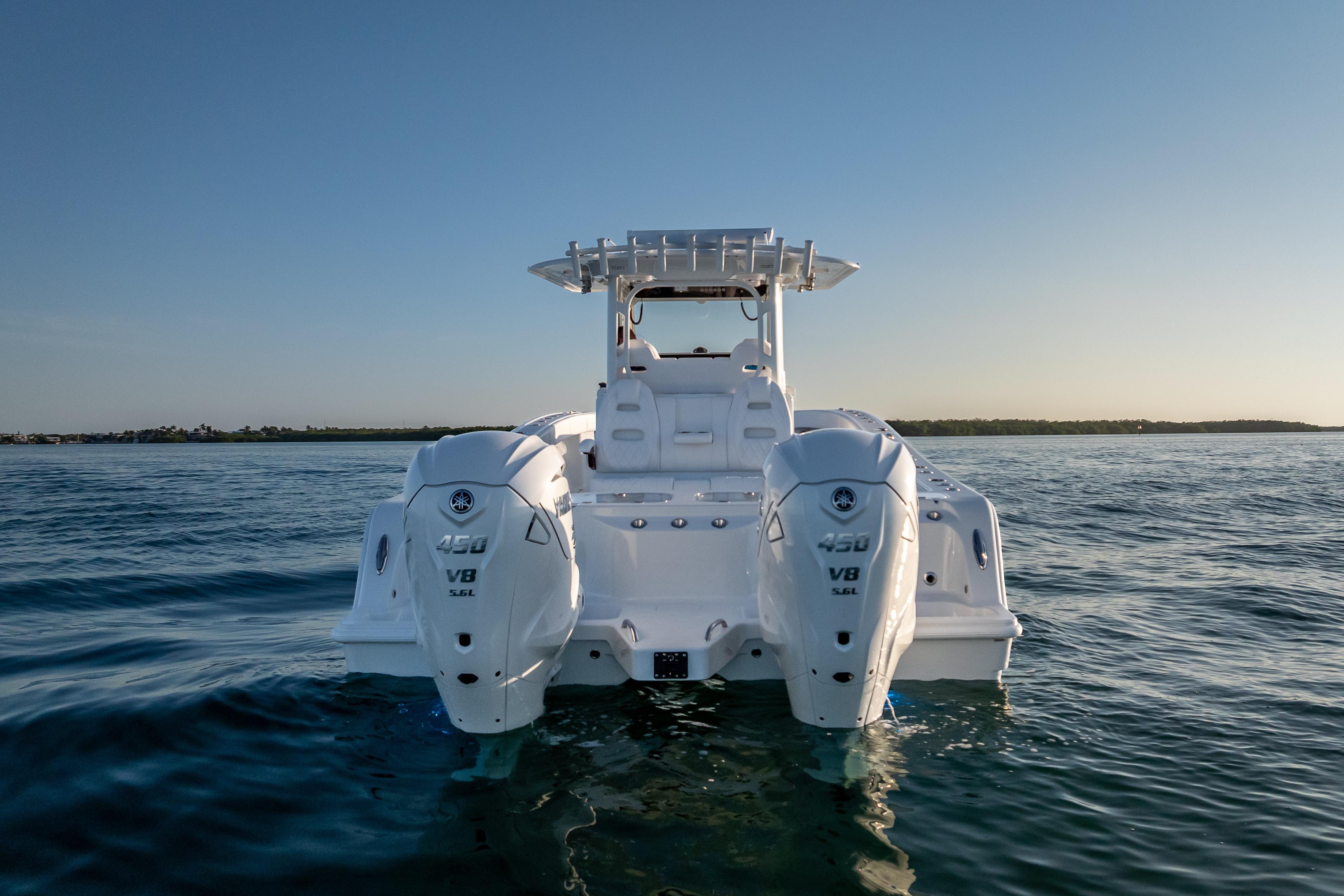2026 Freeman 35 boat with dual V8 engines on calm water.