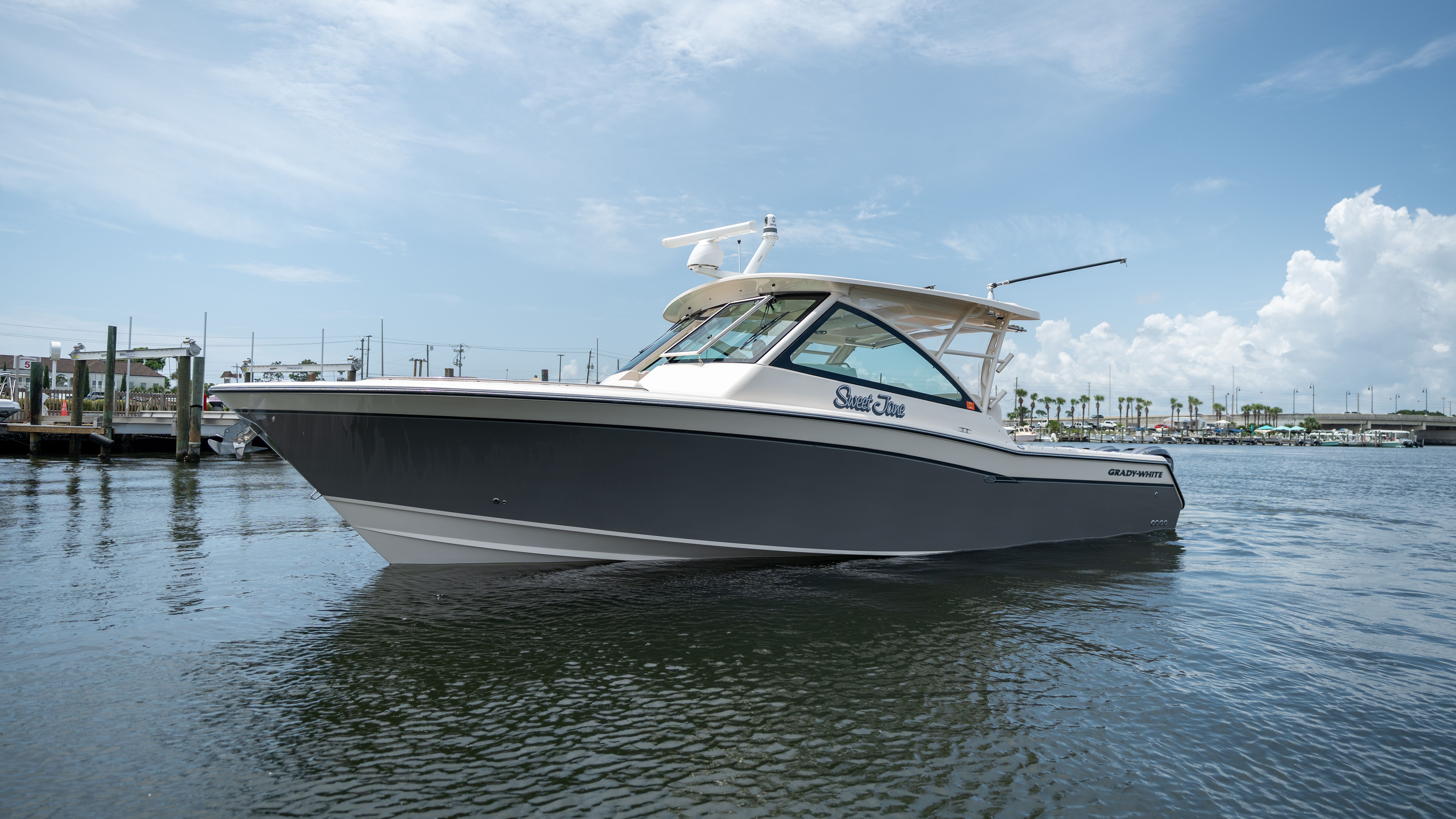 2019 Grady-White 375 Freedom on calm water in a harbor.