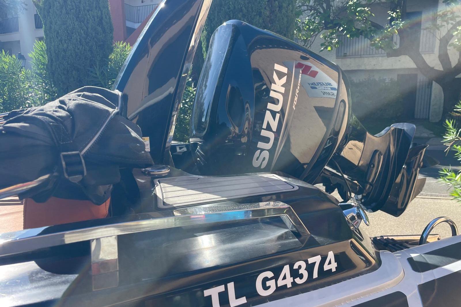 2022 Brig Eagle 6.7 with Suzuki outboard motor in sunny outdoor setting.