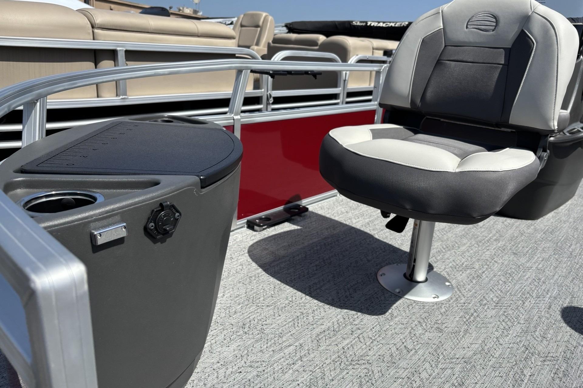 2026 Sun Tracker Bass Buggy 18 DLX pontoon boat interior with seating and console.