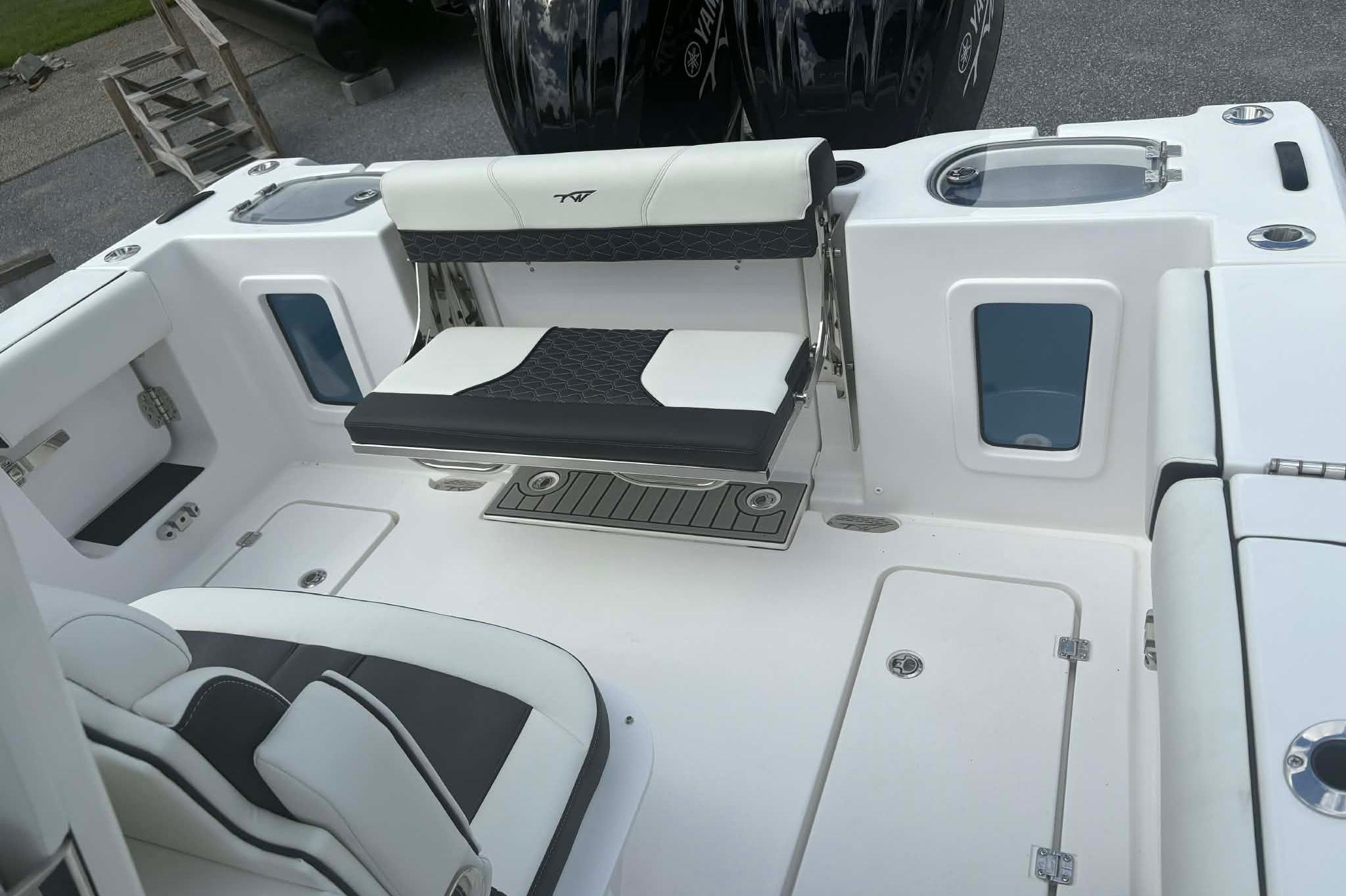 2026 Tidewater 282 CC Adventure boat interior with seating and storage compartments.