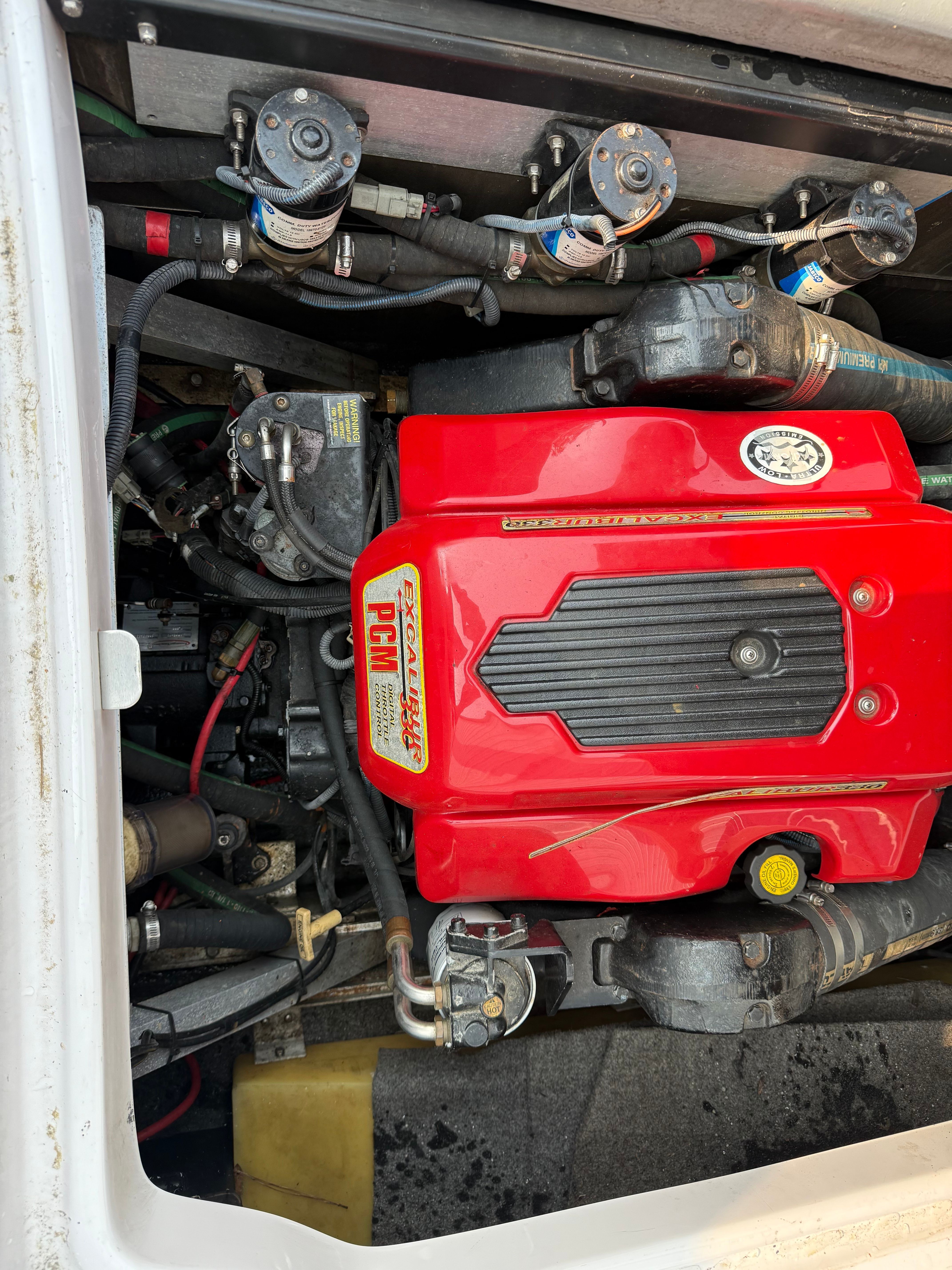 Engine compartment of a 2007 Nautique SV 211 with a red PCM engine.