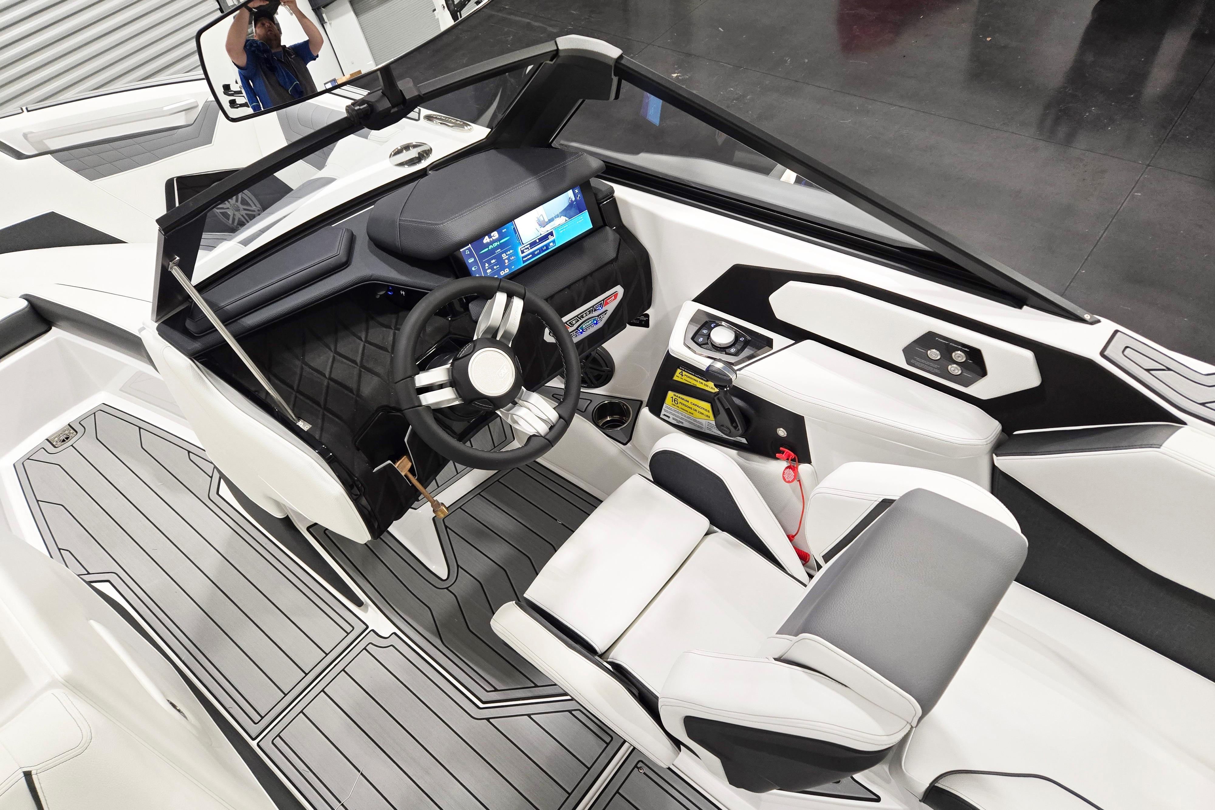 2026 Nautique Super Air Nautique S23 cockpit with modern dashboard and steering wheel.
