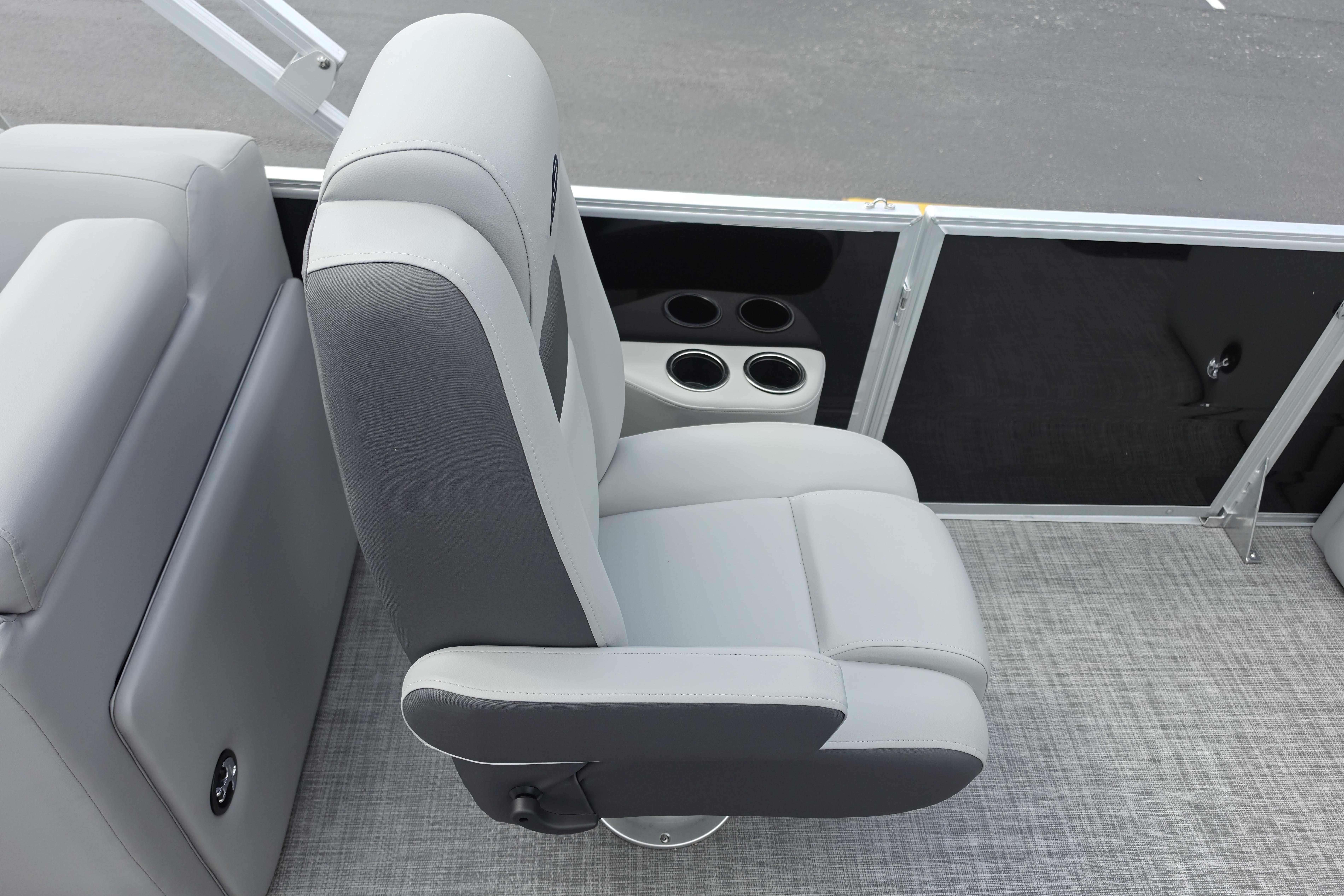Gray seating area on 2026 Sun Tracker Party Barge 24 XP3 with cup holders.