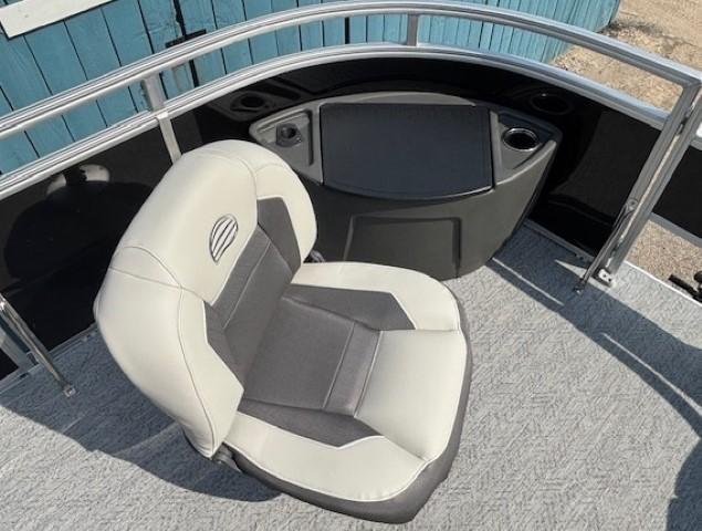 2026 Sun Tracker Fishin' Barge 20 DLX boat seat with gray and white upholstery.