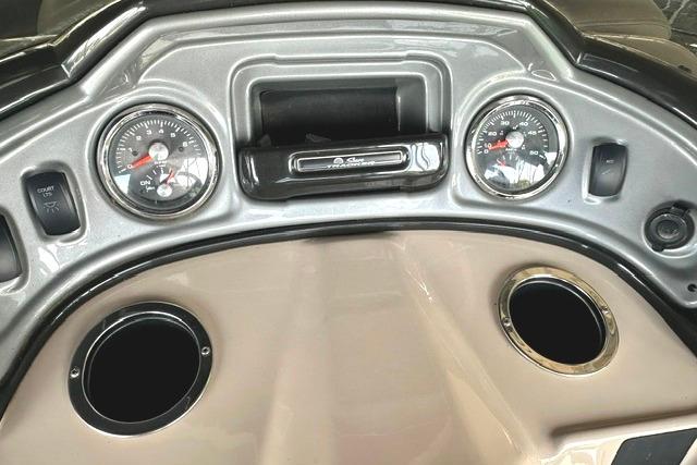 Dashboard of a 2019 Sun Tracker Party Barge 22 XP3 with gauges and cup holders.