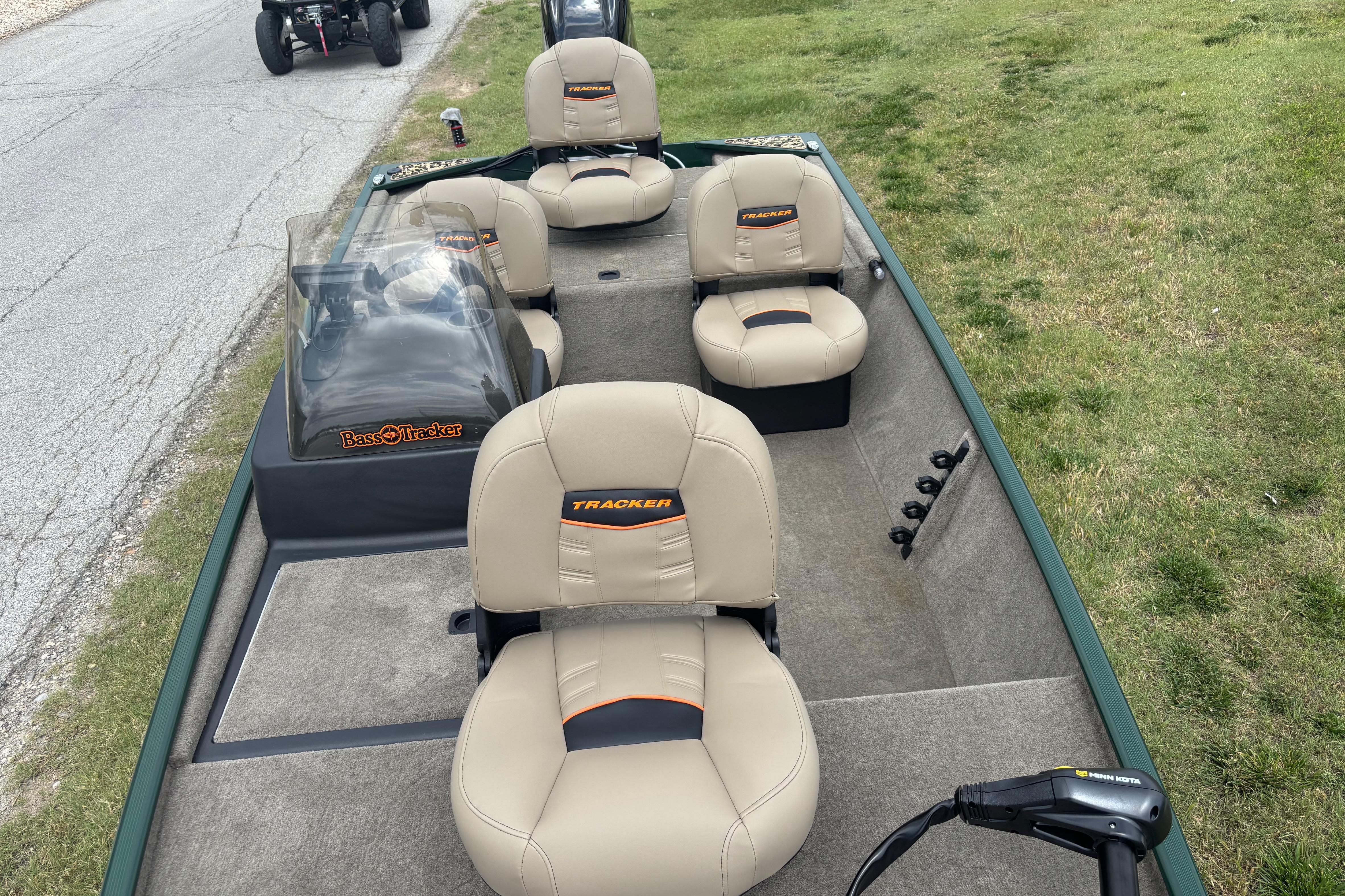 2026 Tracker Bass Tracker Classic Limited boat with beige seats and steering console.