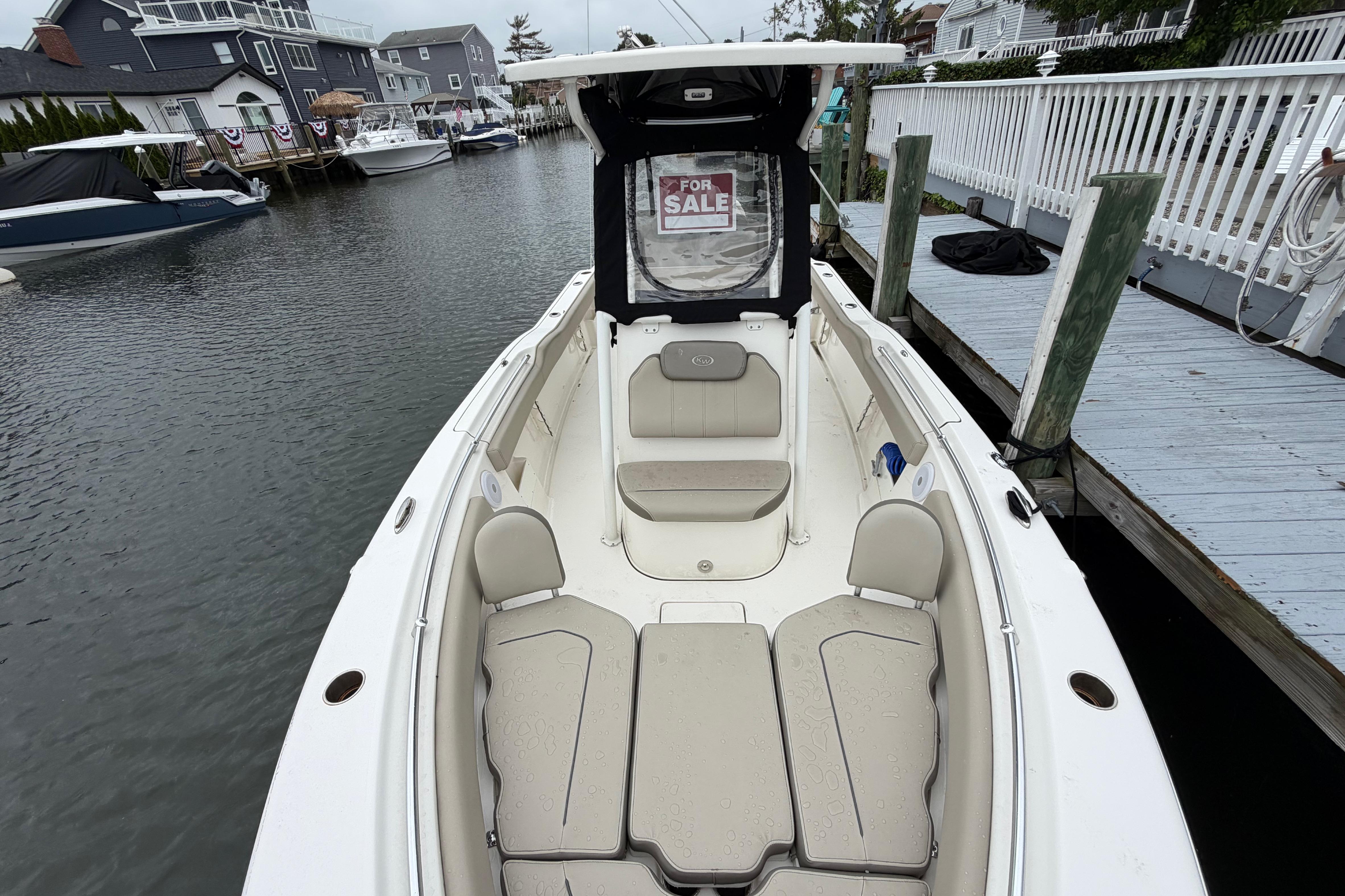 2022 Key West 239 FS boat for sale, docked in a marina.