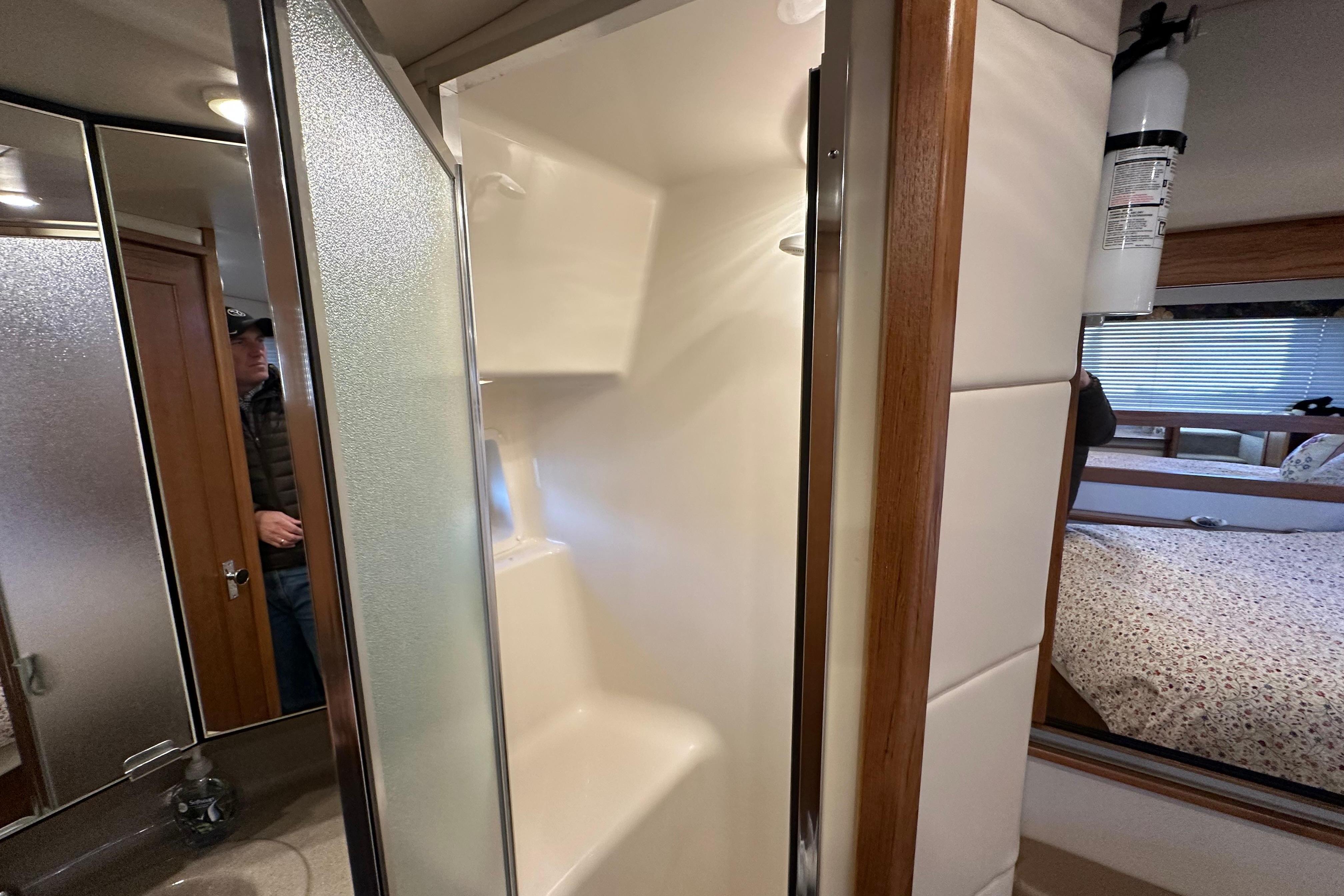 Interior of 2000 Bayliner 4087 Aft Cabin Motoryacht showing bathroom and shower area.