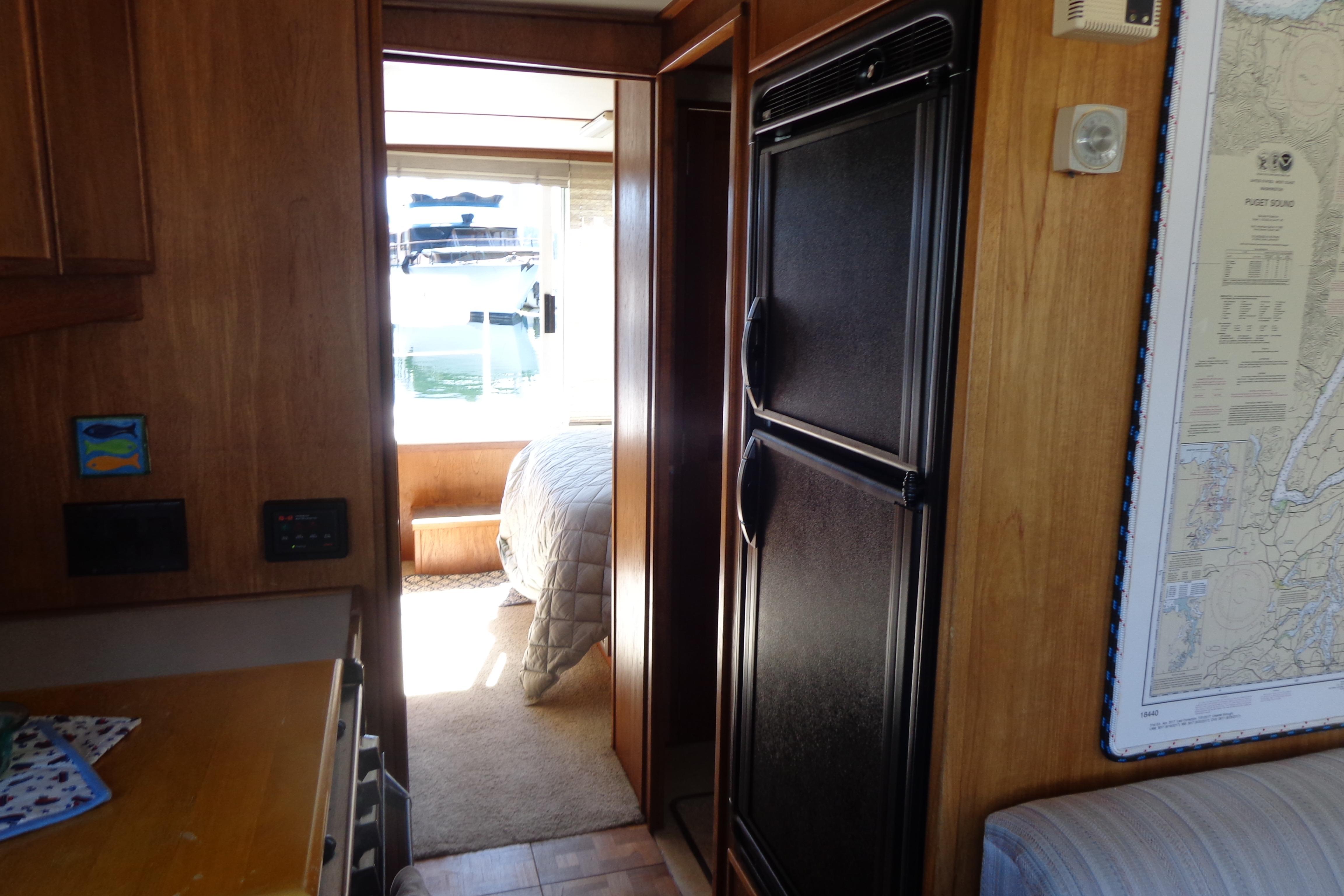 Interior of 1992 Cruise-A-Home Corsair 4200, featuring a cozy cabin and nautical decor.