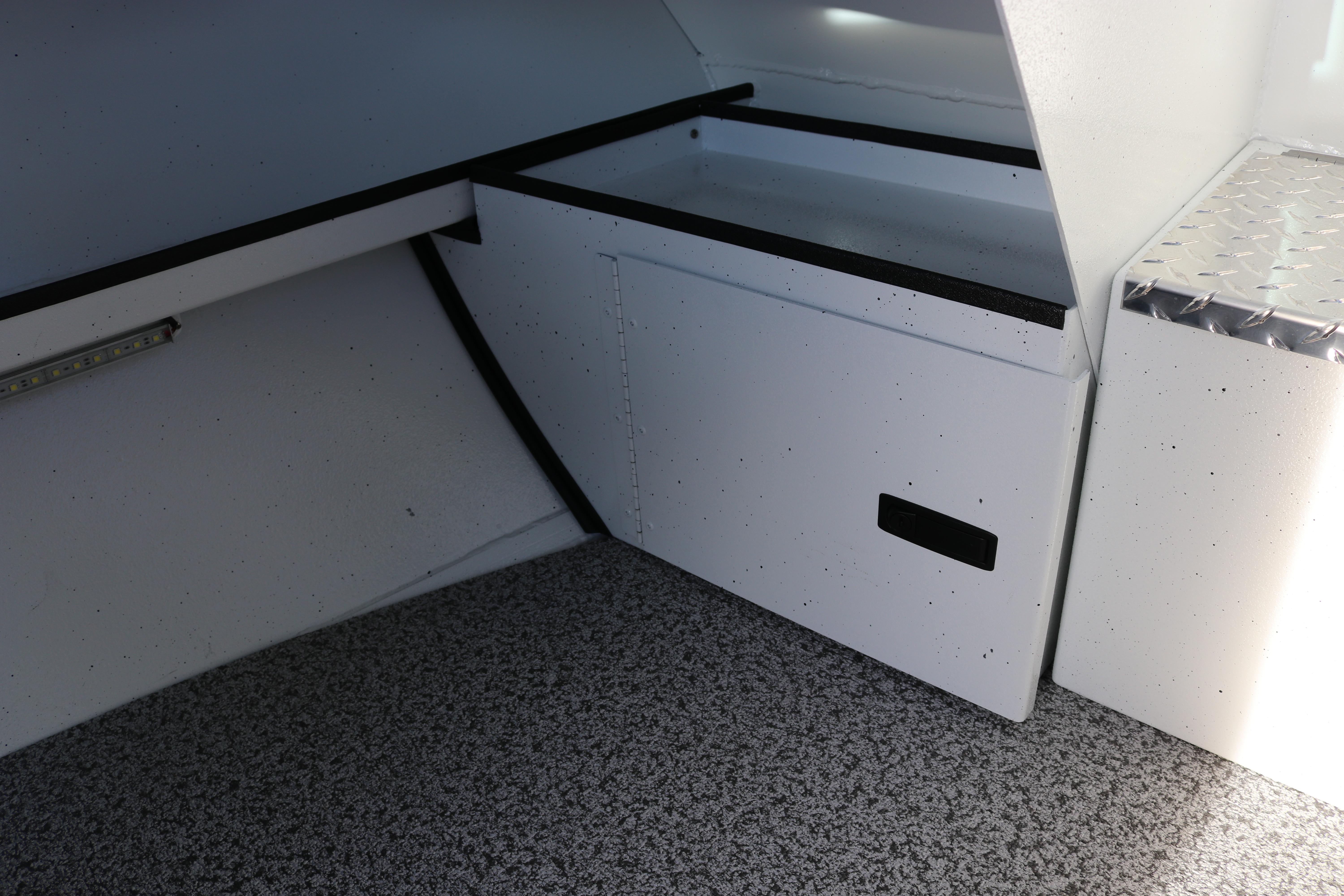 Interior of 2026 Alumaweld Intruder Outboard 22 boat, featuring storage compartments.