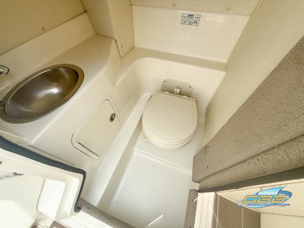 2008 Sea Ray 270 SLX boat bathroom with sink and toilet.