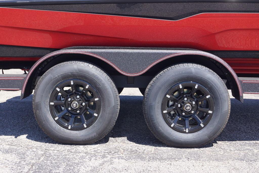 Trailer wheels of a 2026 Skeeter ZXE21 boat, featuring black rims and red accents.