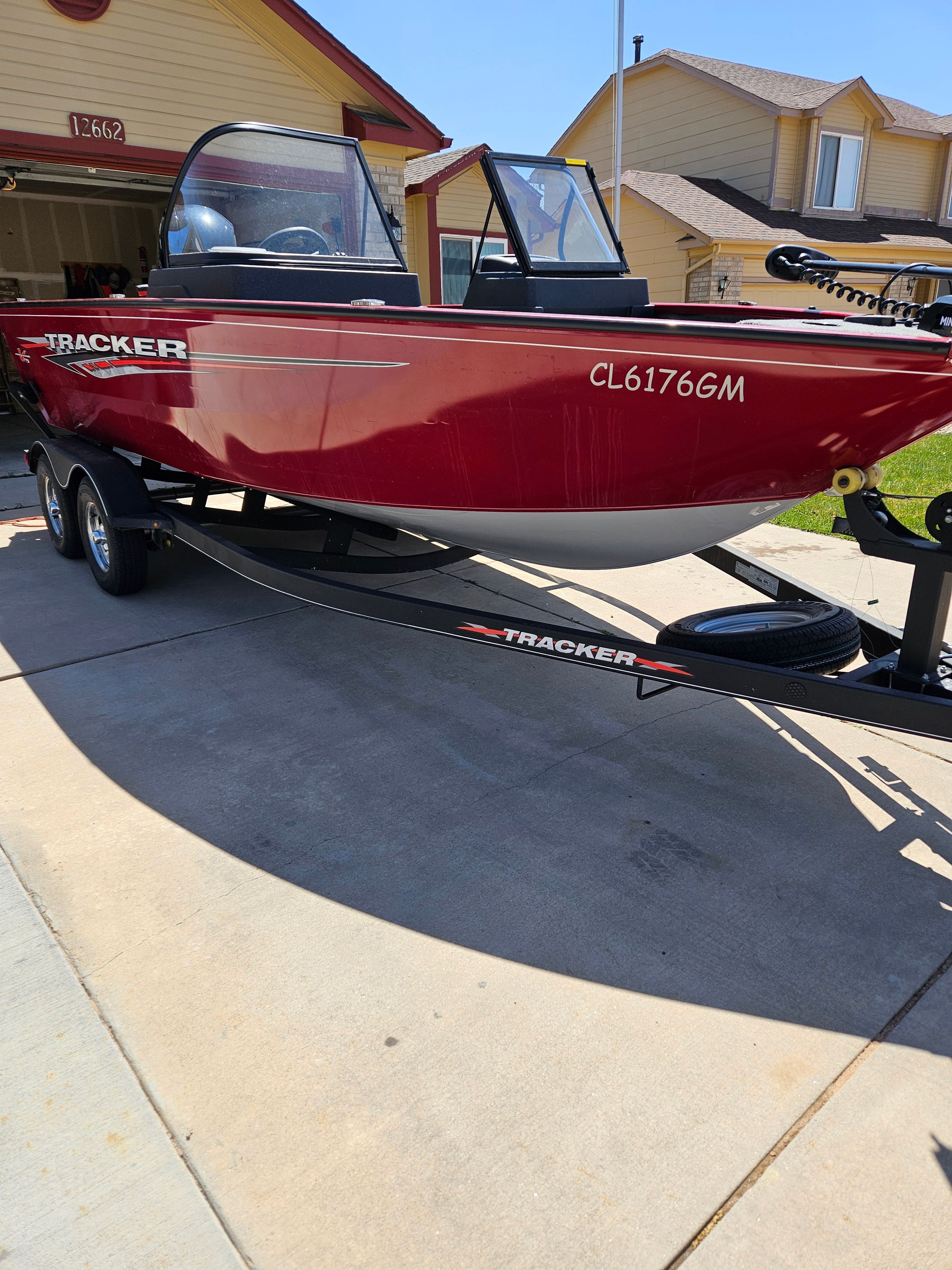 Red 2021 Tracker Pro Guide V-175 WT boat on trailer.