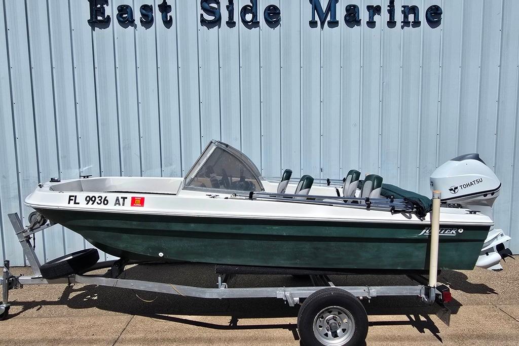 1971 Jupiter 15' Tri Hull boat with Tohatsu motor on trailer at East Side Marine.