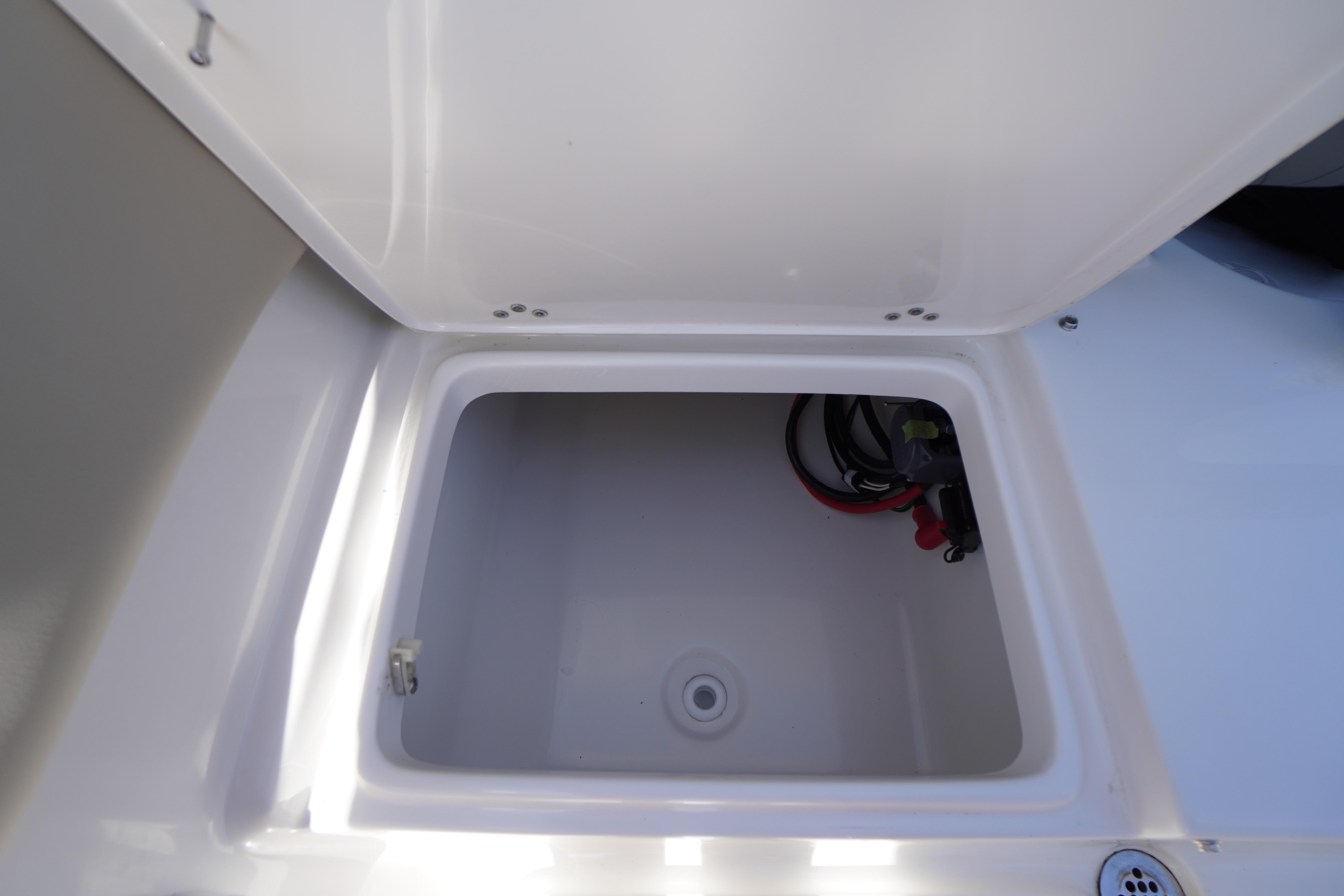 Open storage compartment on 2025 Key West 203 FS boat.