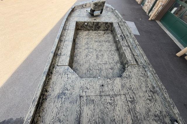 2026 Tracker Grizzly 1654 T Sportsman boat with camouflage design, viewed from above.
