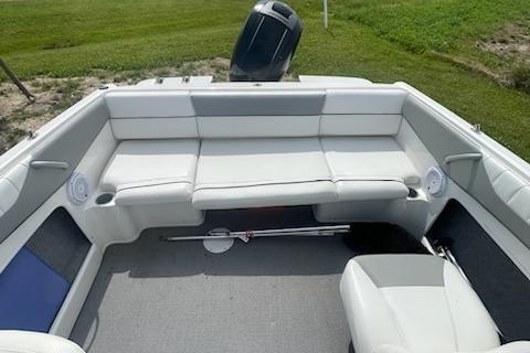 2013 Bayliner 190 Bowrider interior with white seating and spacious layout.