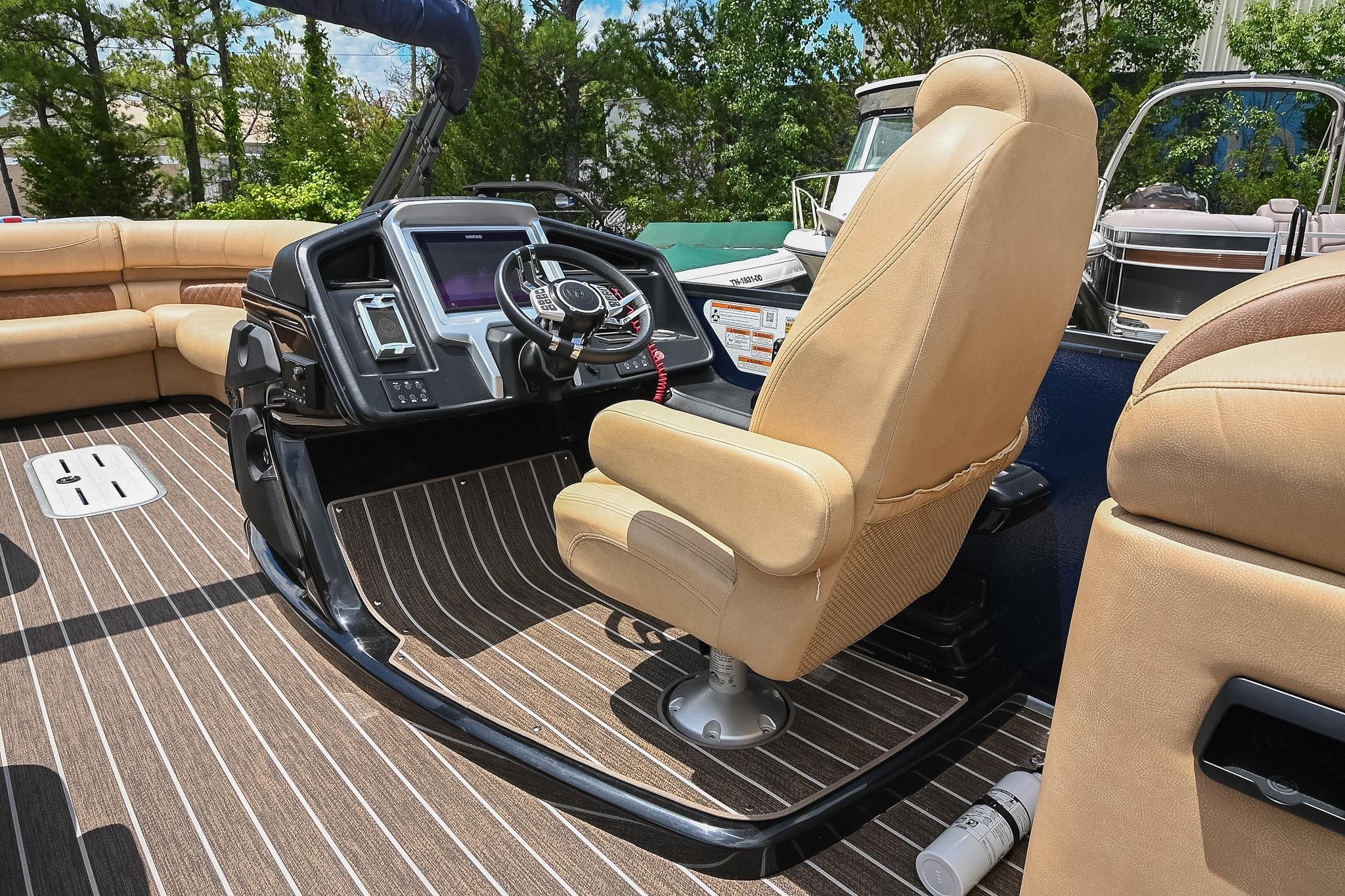2023 Premier 270 Intrigue RF boat interior with captain's chair and control panel.
