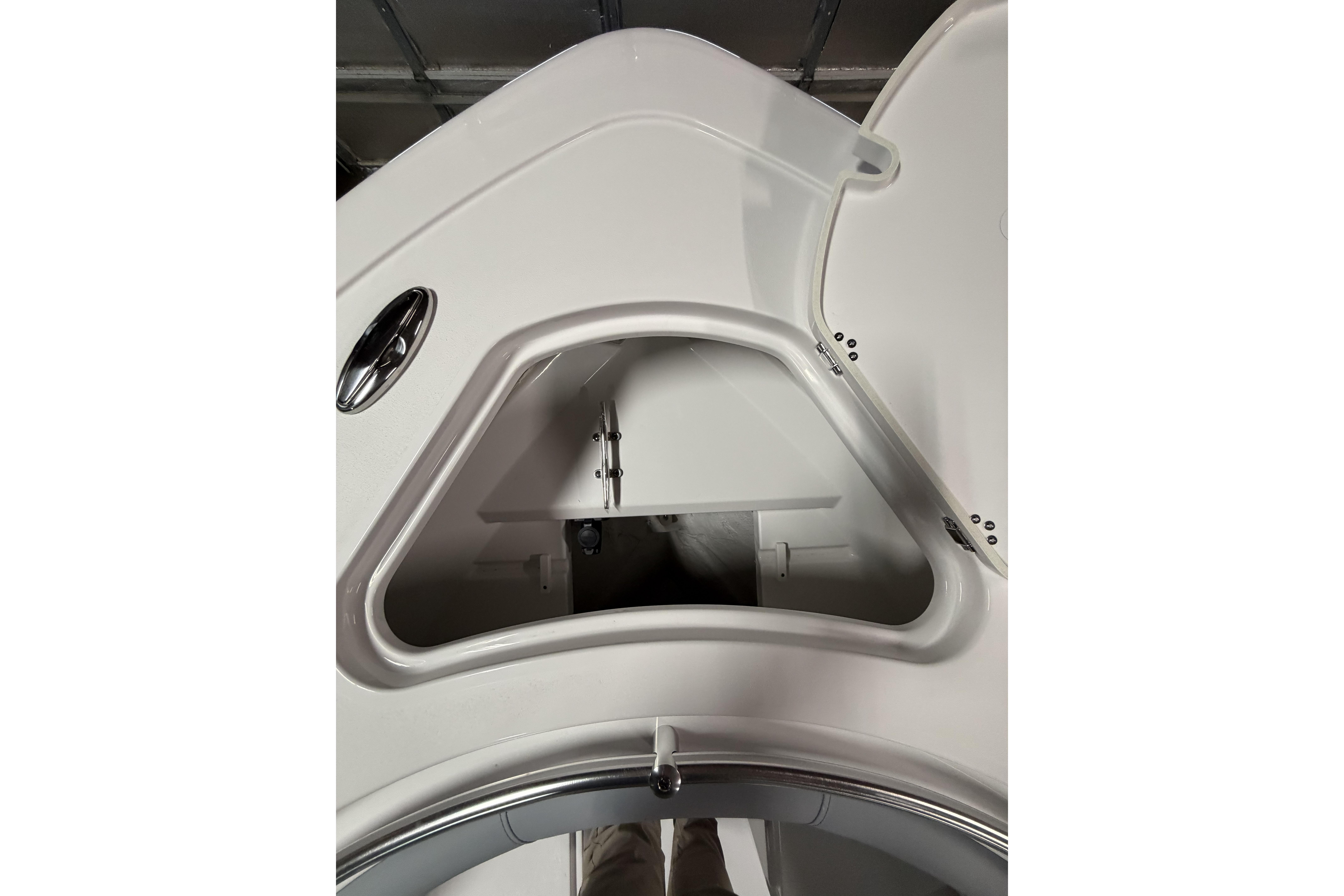 2026 Sportsman Open 232 Center Console boat storage compartment detail.