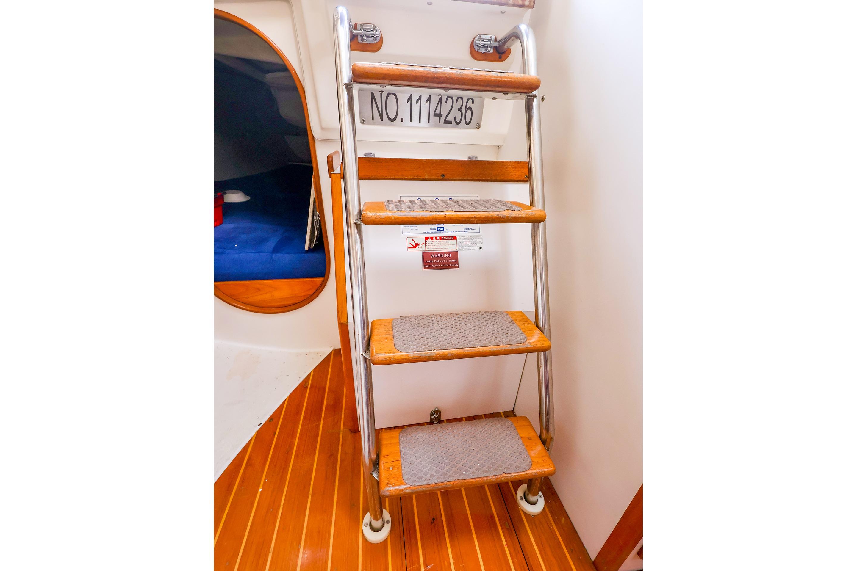 Interior of 2001 J Boats J/32 sailboat showing wooden steps and cabin entrance.