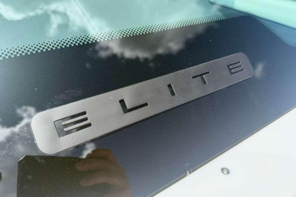 Close-up of 2026 Monterey Elite 30 OB logo on a reflective surface.
