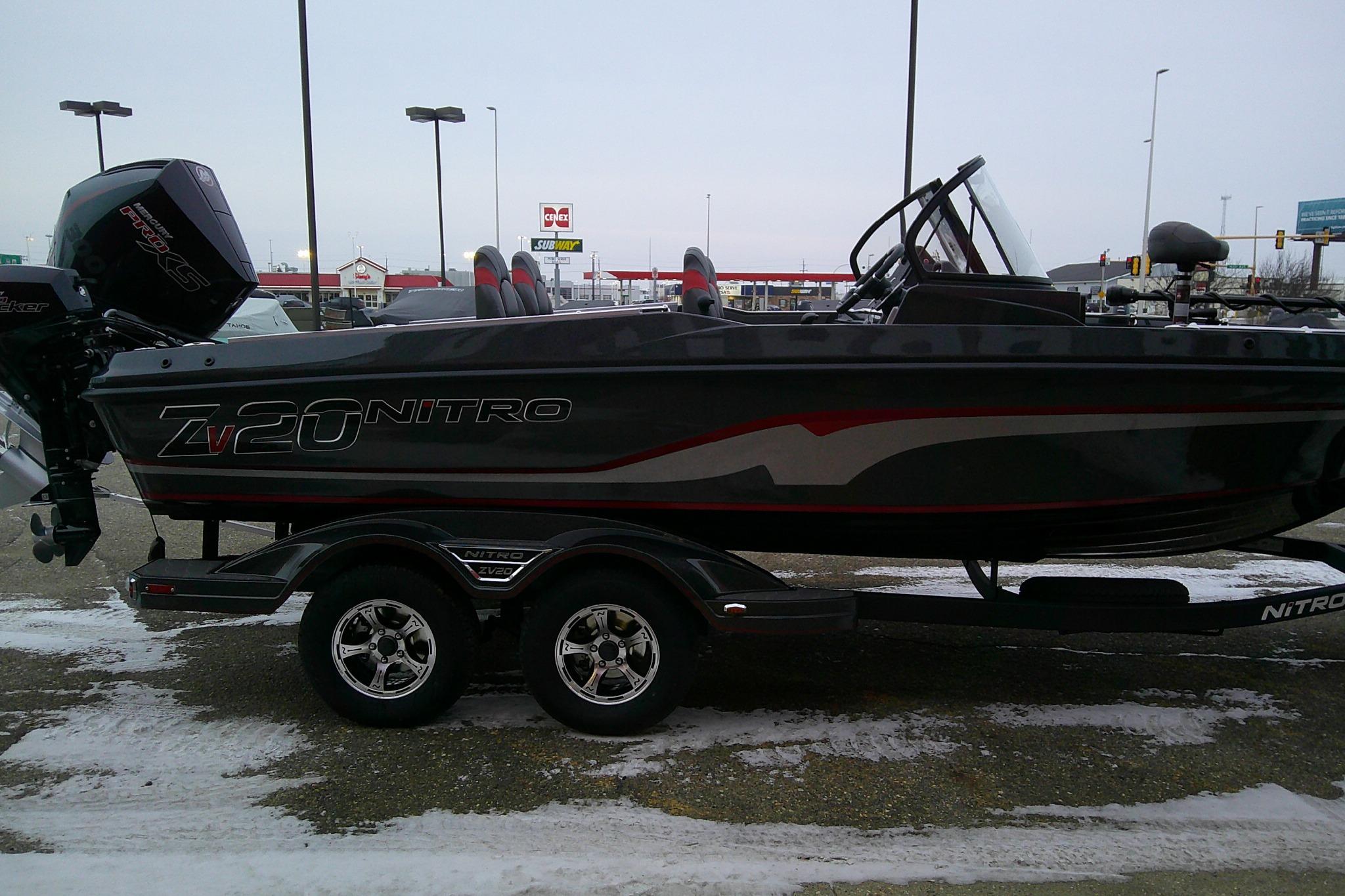 2026 Nitro ZV20 Pro boat on trailer in parking lot.