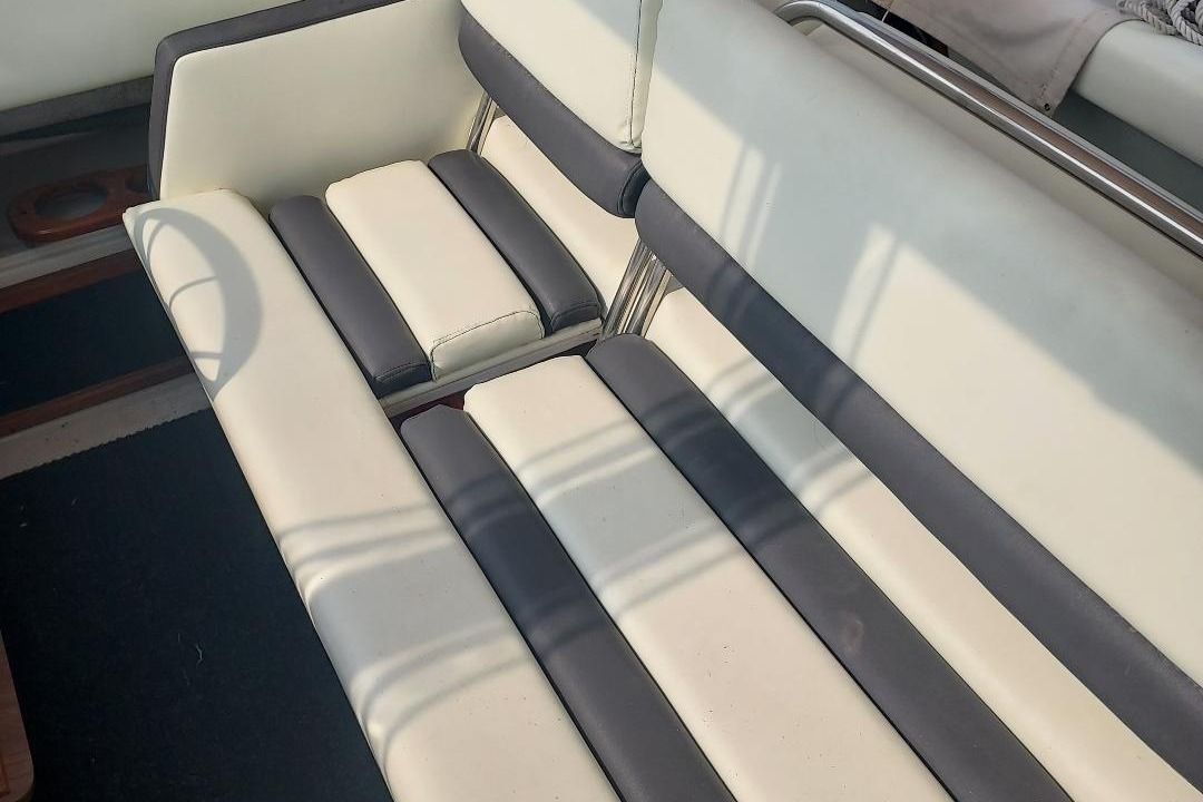 Interior view of a 1987 Regal Commodore with white and black upholstery.