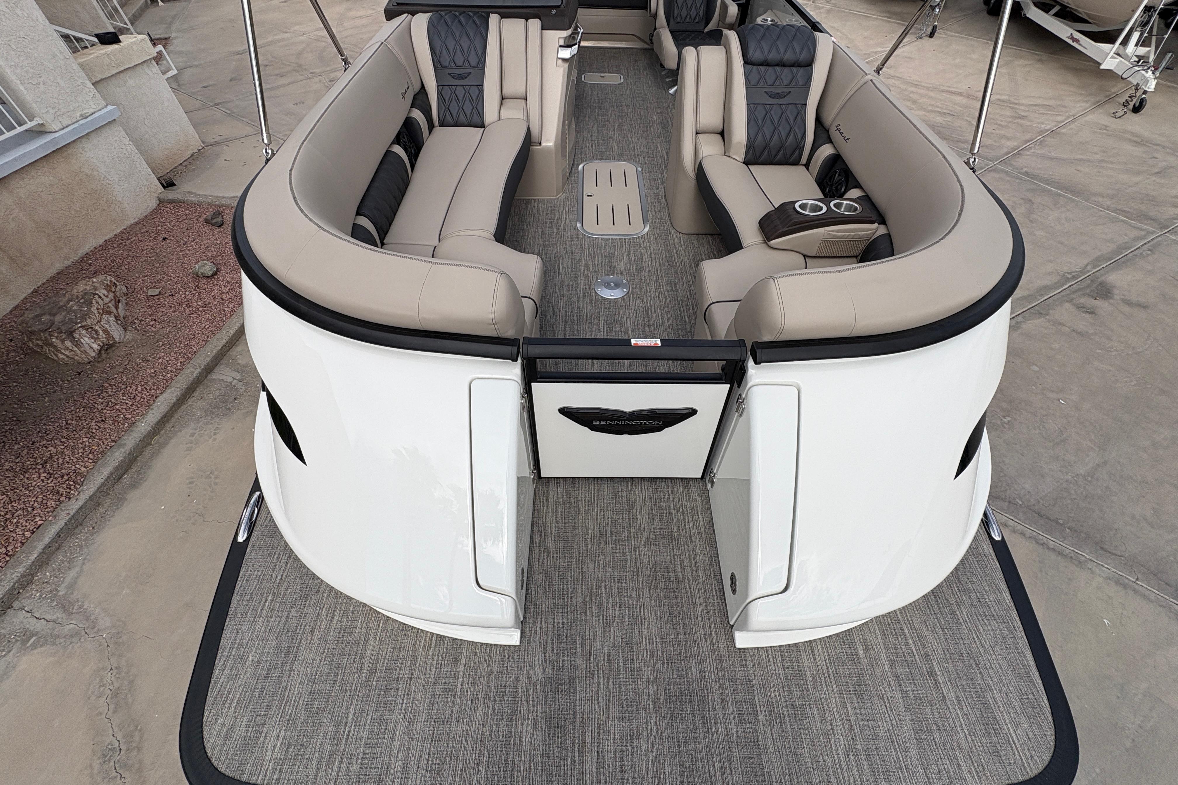 Luxurious interior of 2026 Bennington 25 QXSBA pontoon boat with plush seating and modern design.