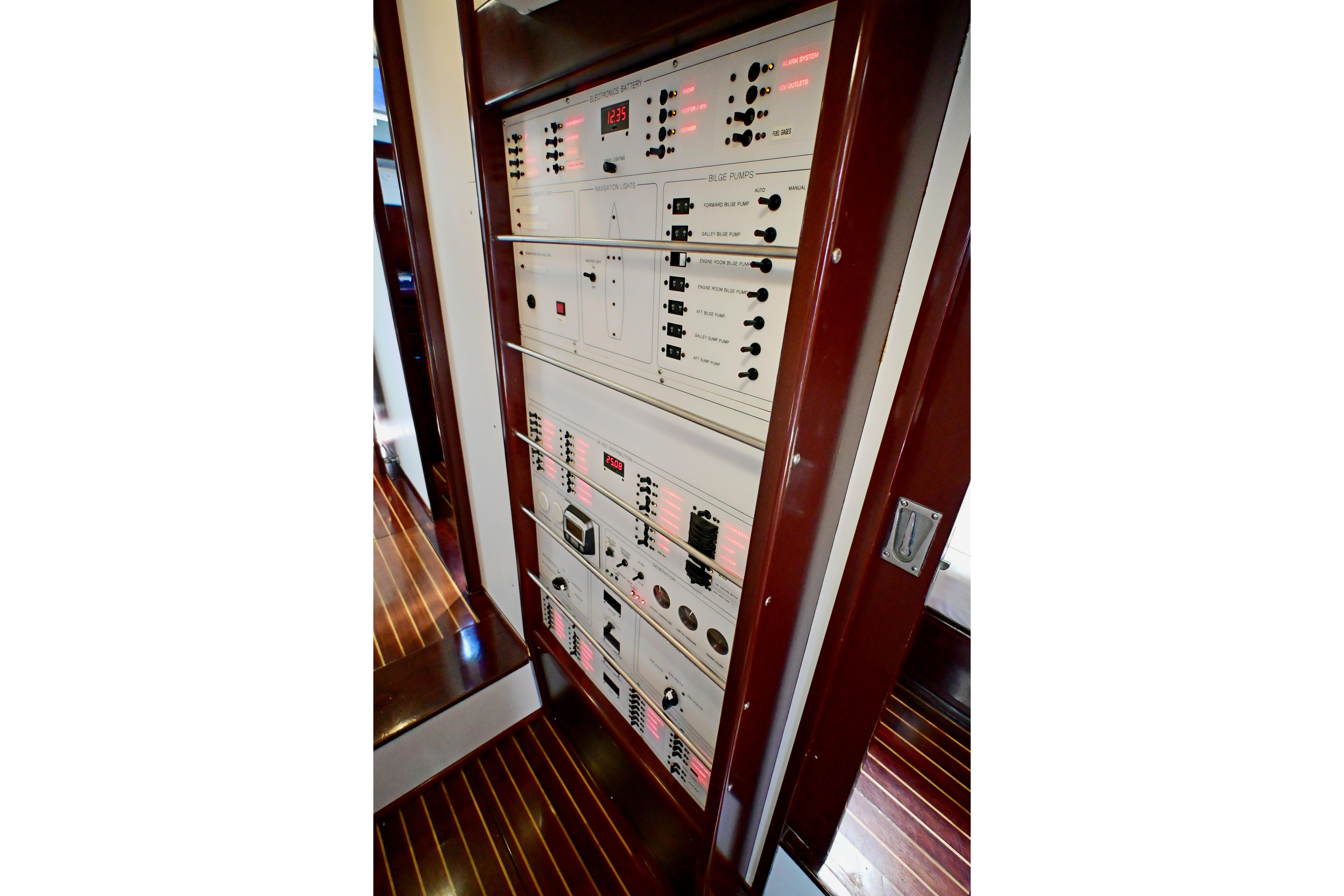 Electrical control panel on a 1968 Abeking & Rasmussen Tripp 74 yacht, featuring switches and indicators.