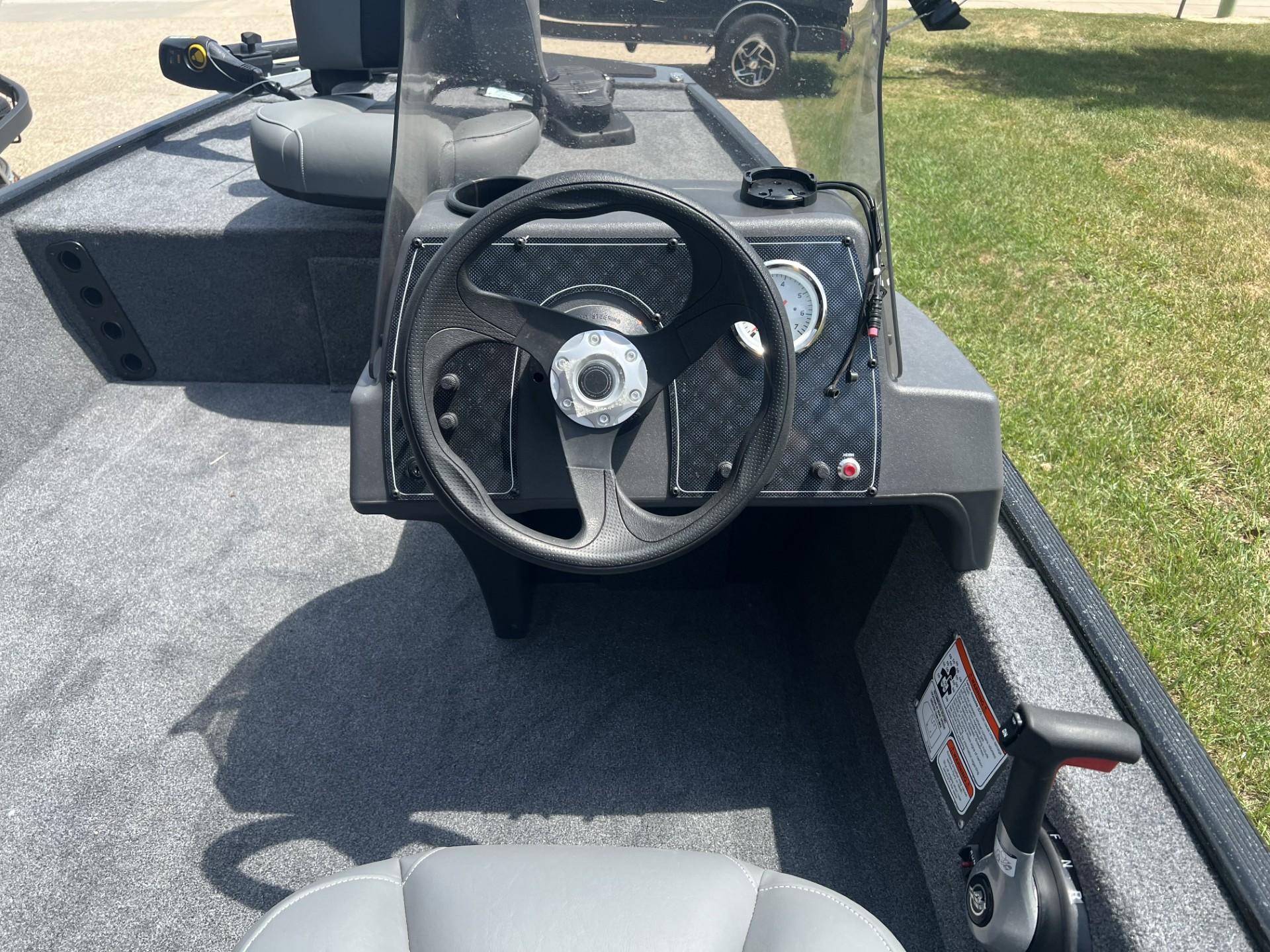 2025 Tracker Bass Tracker Classic XL boat cockpit with steering wheel and controls.