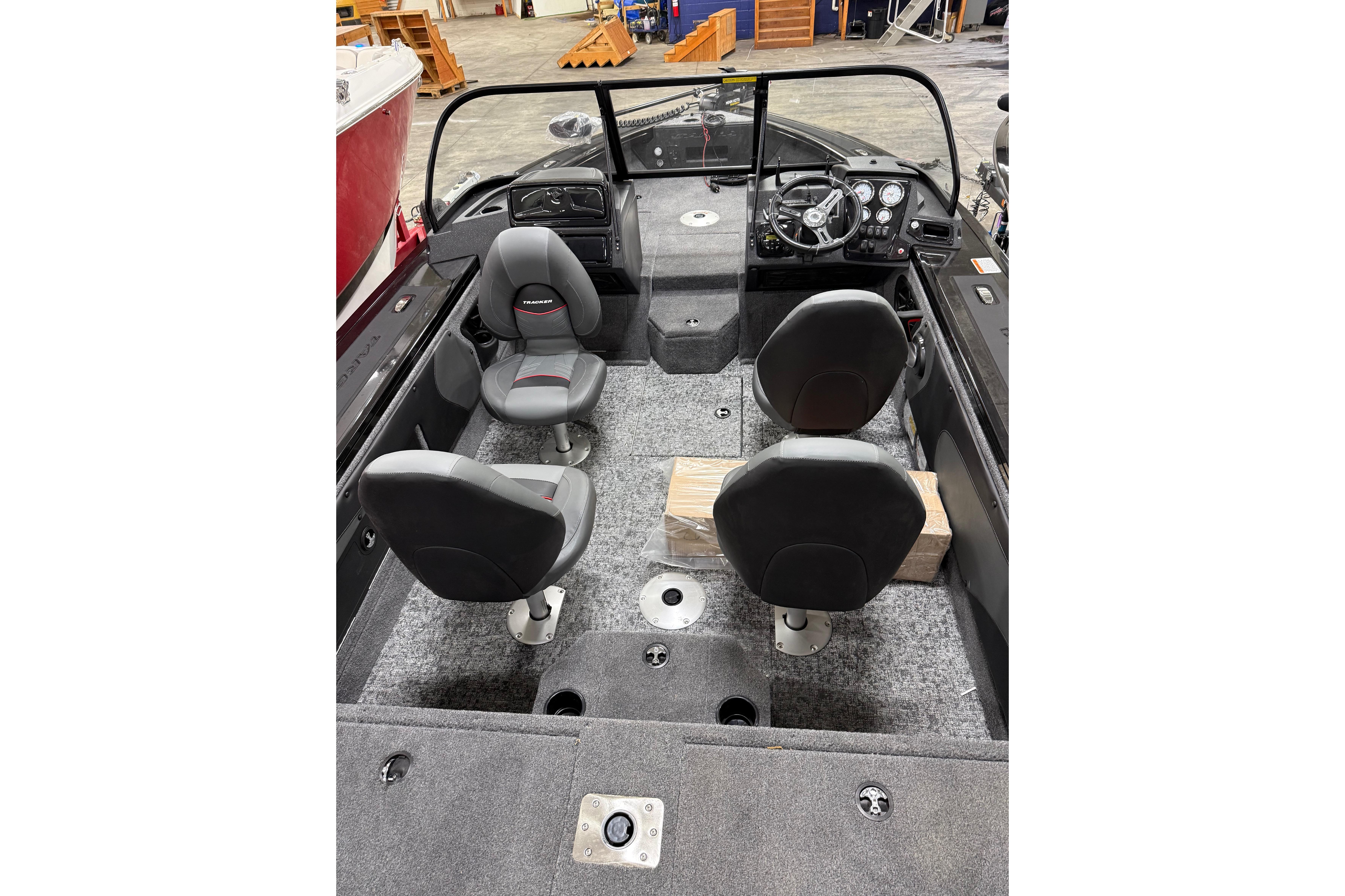 2026 Tracker Targa V-19 WT boat interior with four seats and steering console.