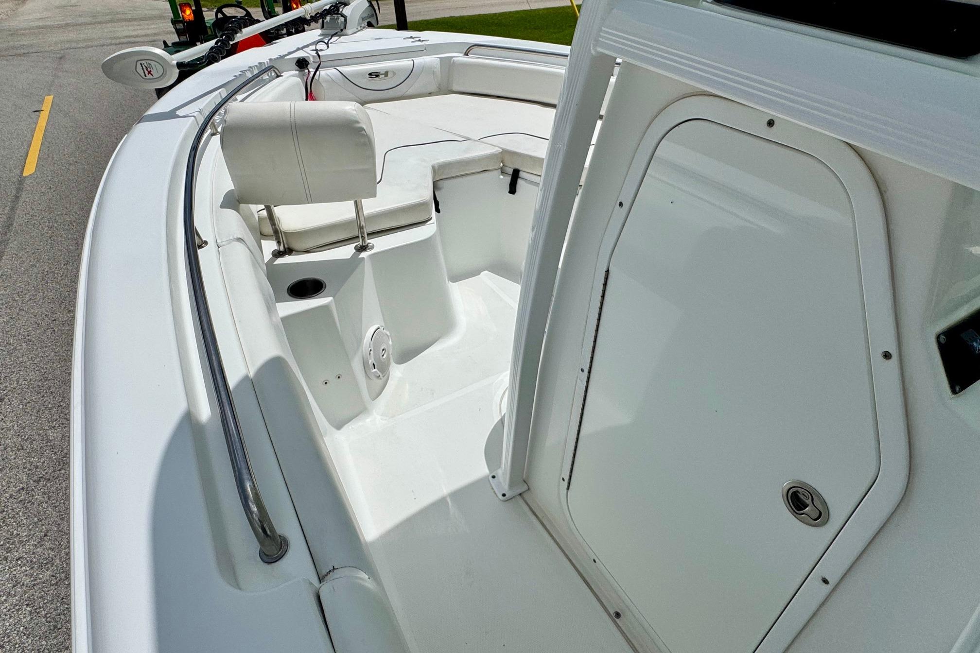 2015 Sea Hunt Ultra 234 boat interior with seating and storage compartments.