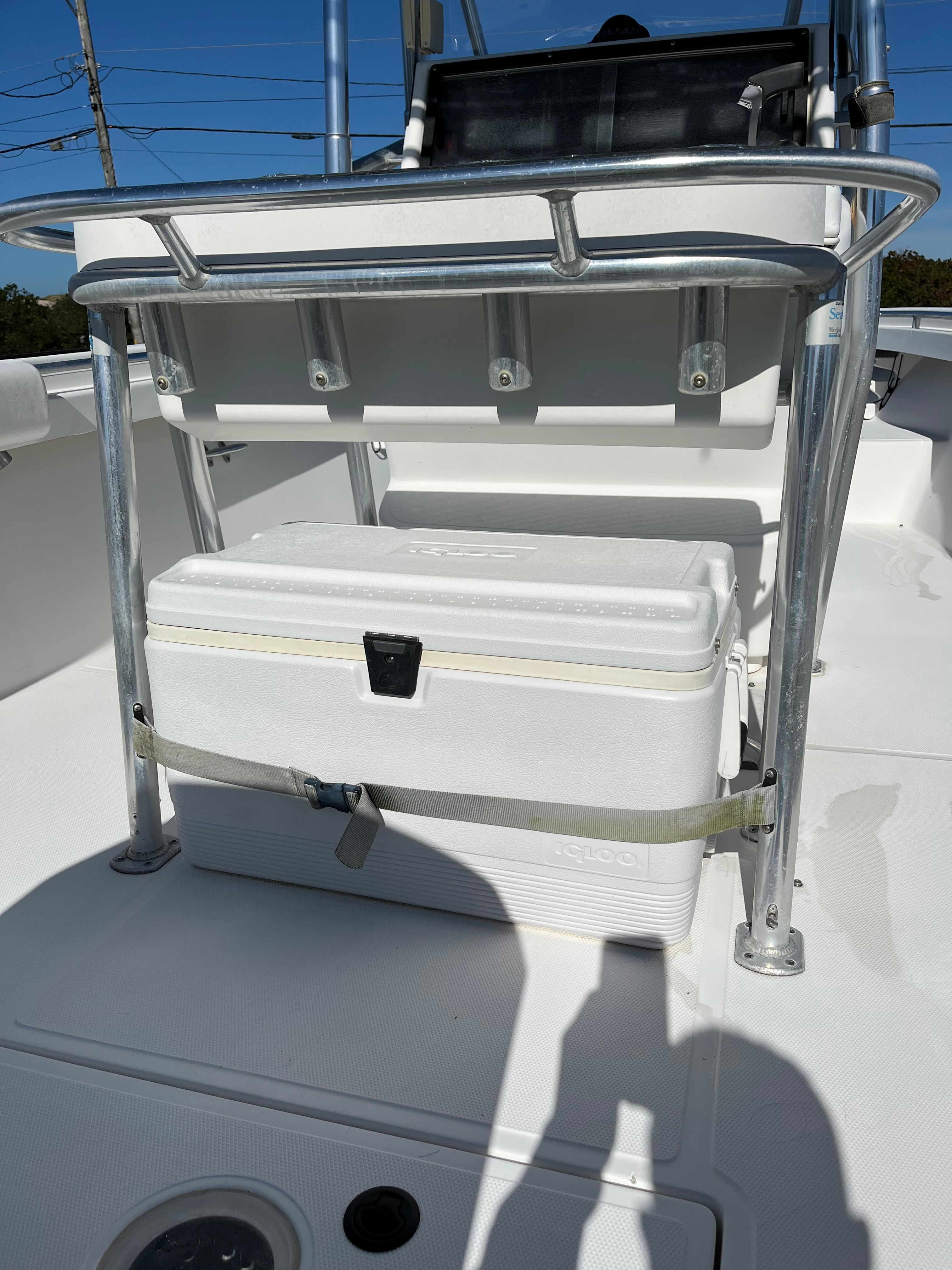2001 SeaCraft boat with cooler and stainless steel holders.