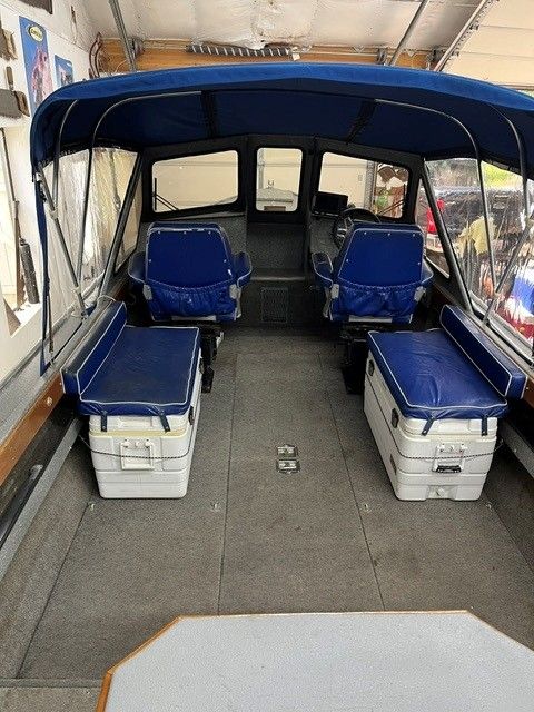 Interior of a 1986 custom jet boat with blue seating.