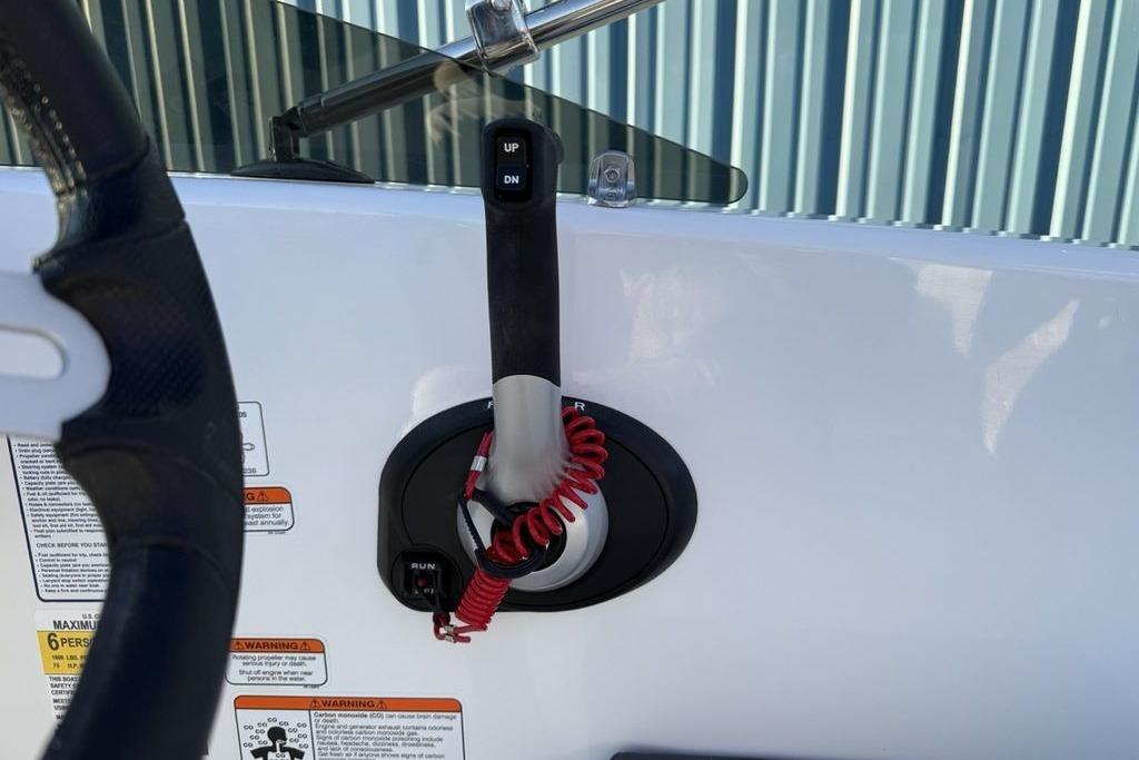 2026 Tahoe T16 boat control panel with throttle lever and safety lanyard.