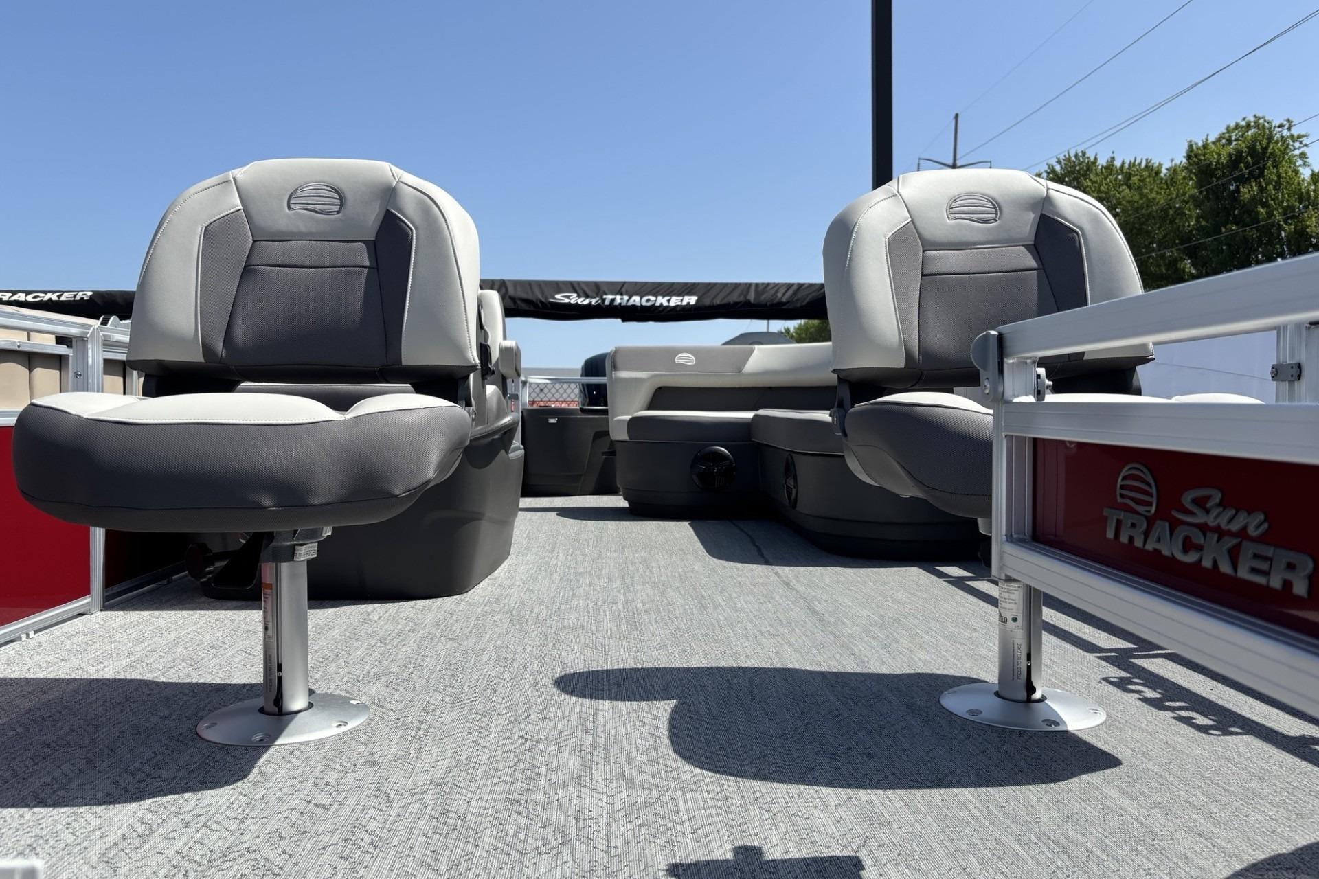 2026 Sun Tracker Bass Buggy 18 DLX pontoon boat interior with seating and branding.