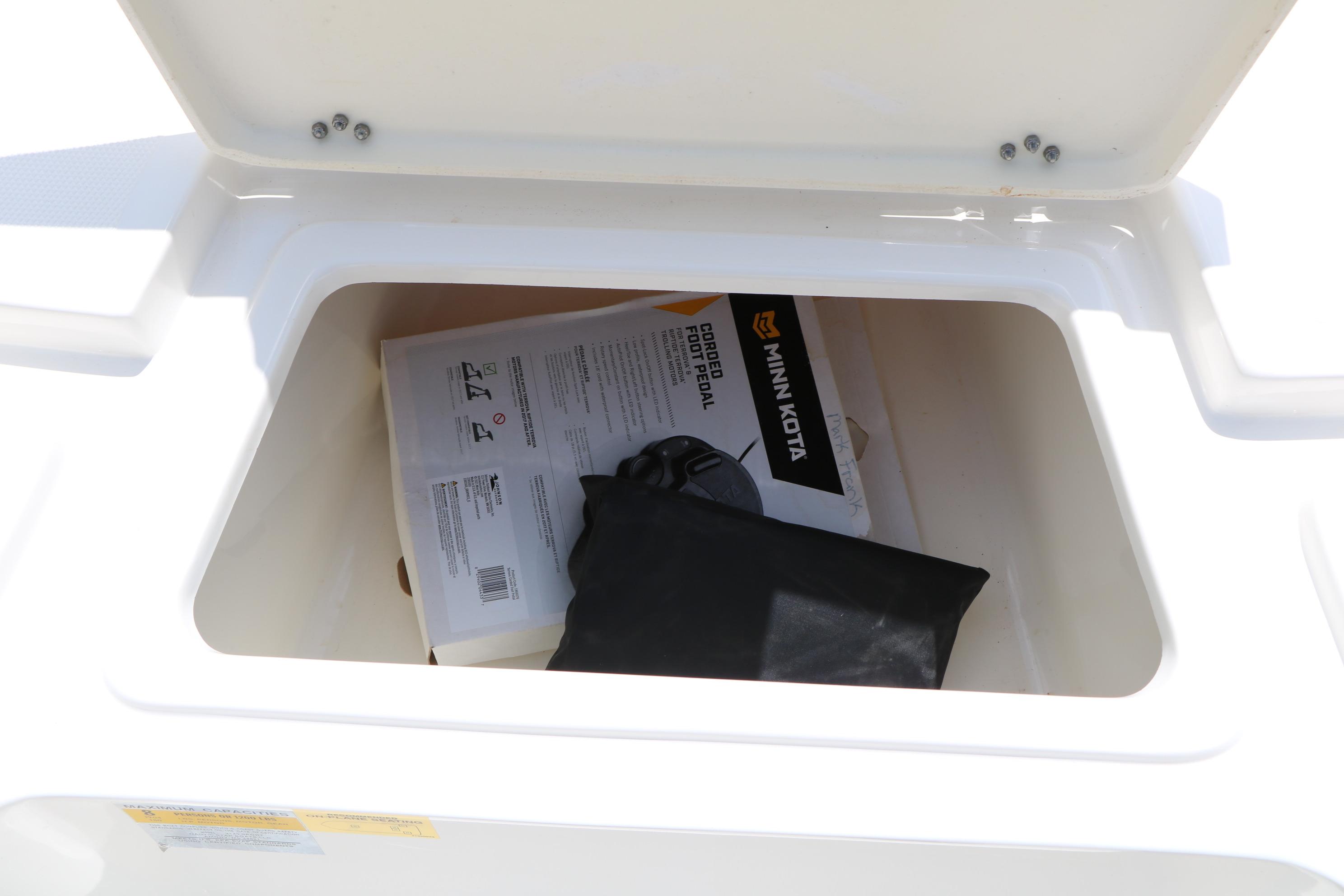 Storage compartment of 2020 NauticStar 2140 Sport boat with Minn Kota accessories.