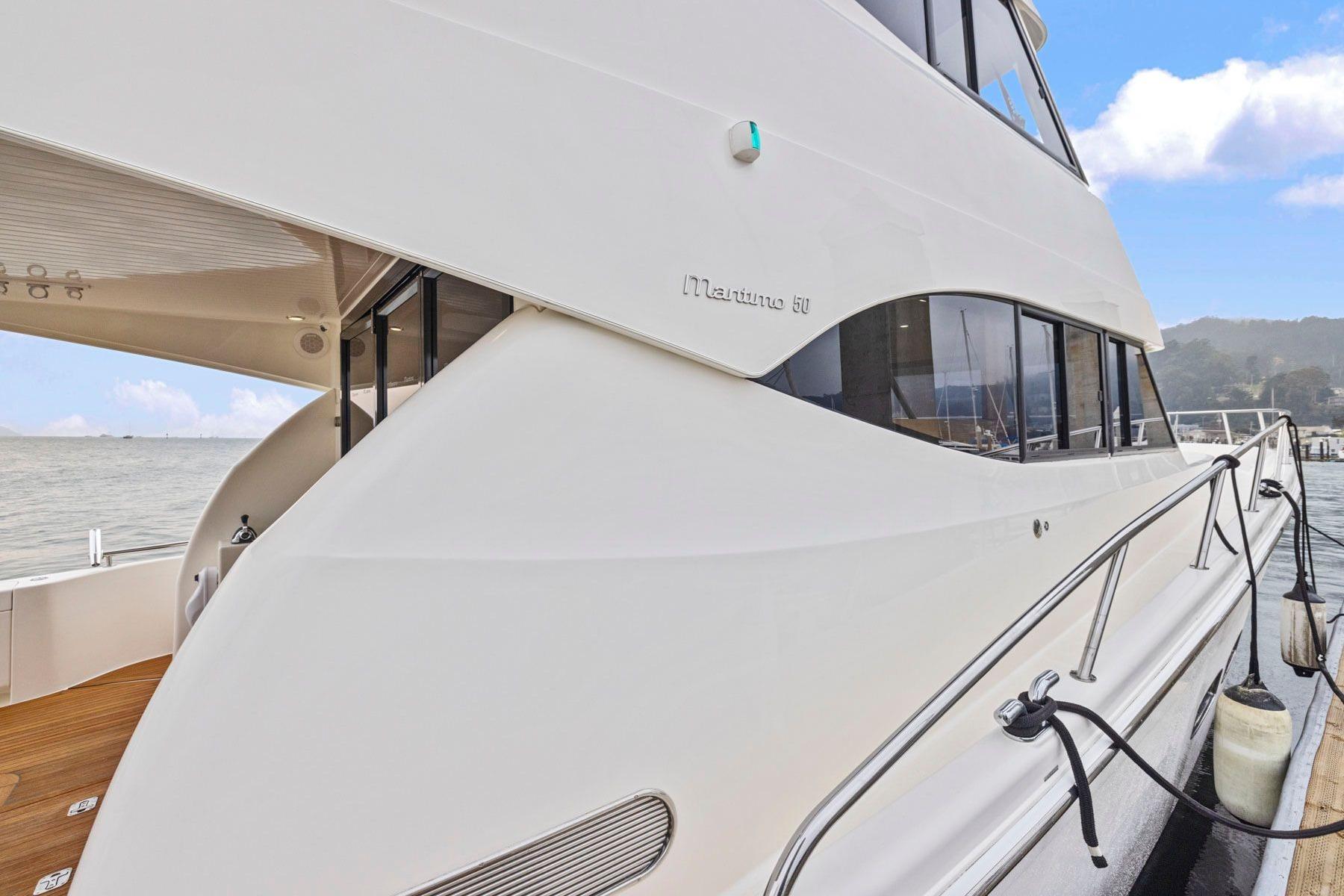 2014 Maritimo M50 yacht docked, showcasing sleek design and modern features.