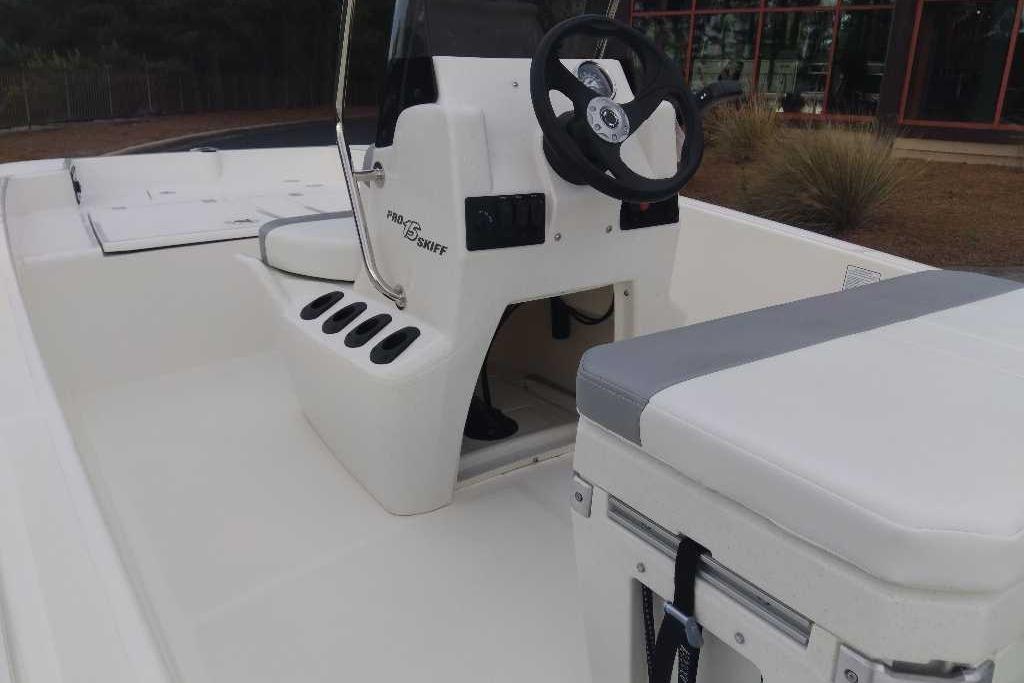 2026 Mako Pro Skiff 15 CC boat interior with steering console and seating.