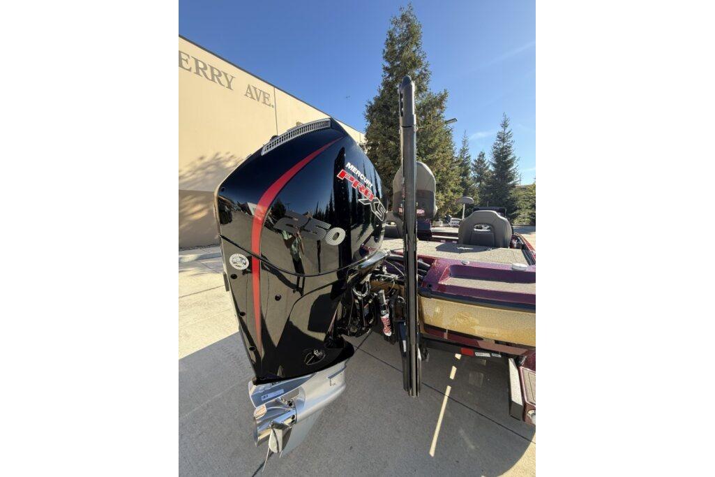 2026 Nitro Z21 XL Pro boat with powerful Mercury engine, parked outdoors.