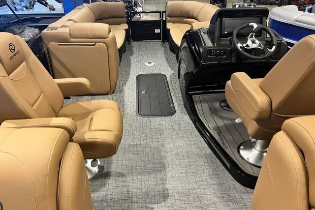 Luxurious 2026 Regency 230 DL boat interior with tan leather seating and modern helm.