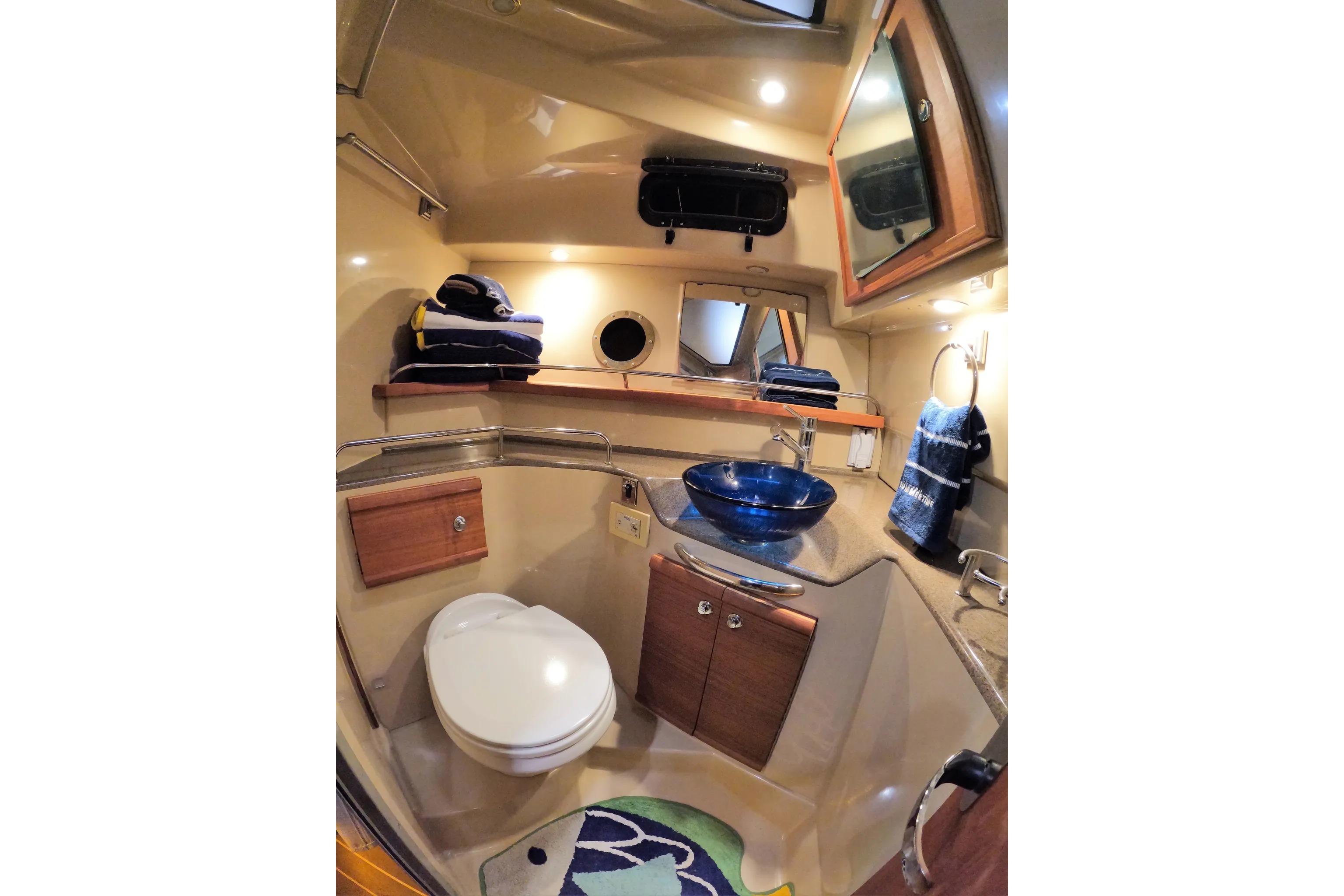 Luxurious 2015 Ranger Tugs R-29 S bathroom with modern fixtures and elegant design.