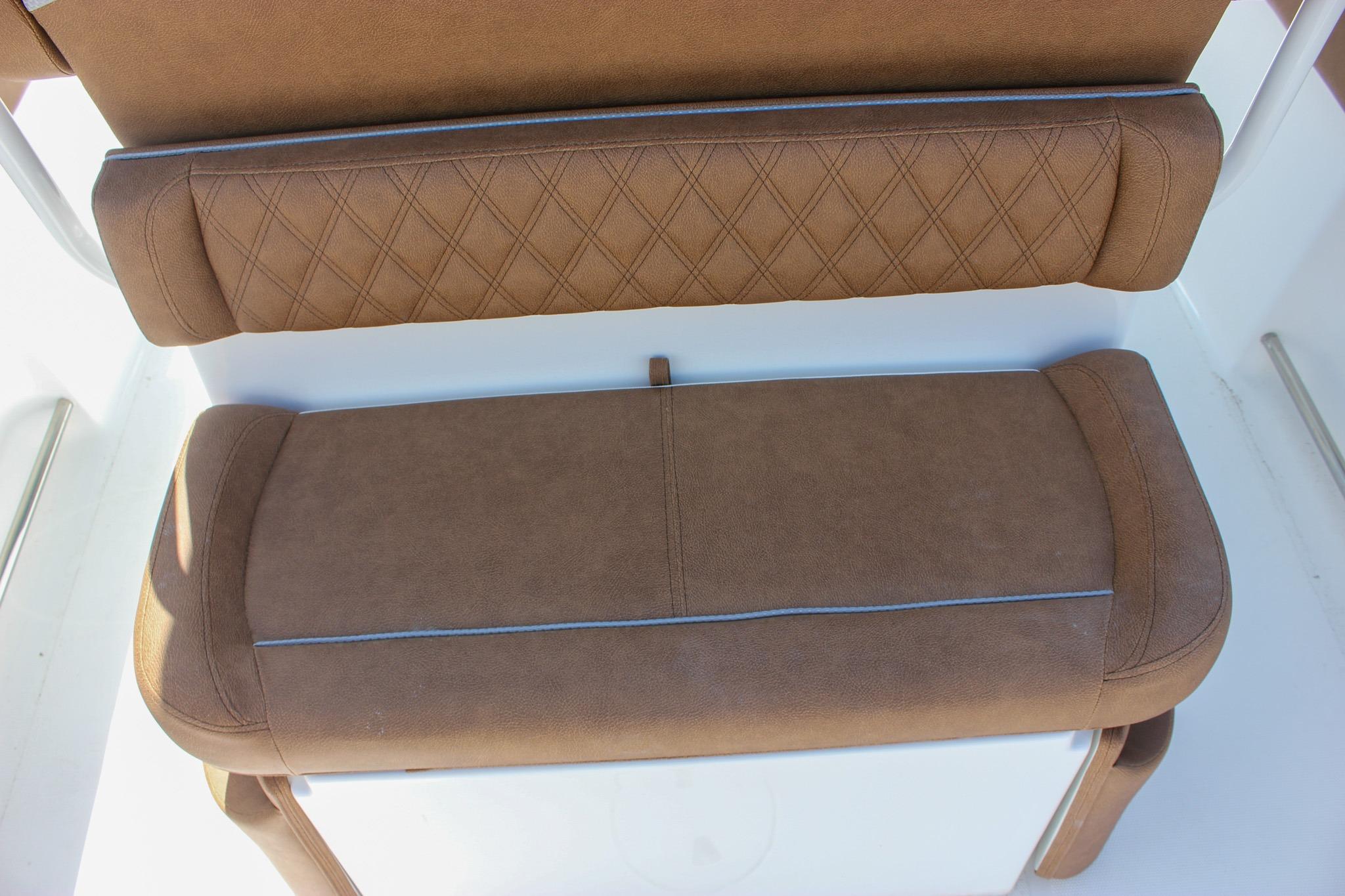Brown cushioned seating on 2027 Sea Hunt Ultra 234 boat, featuring diamond stitching.