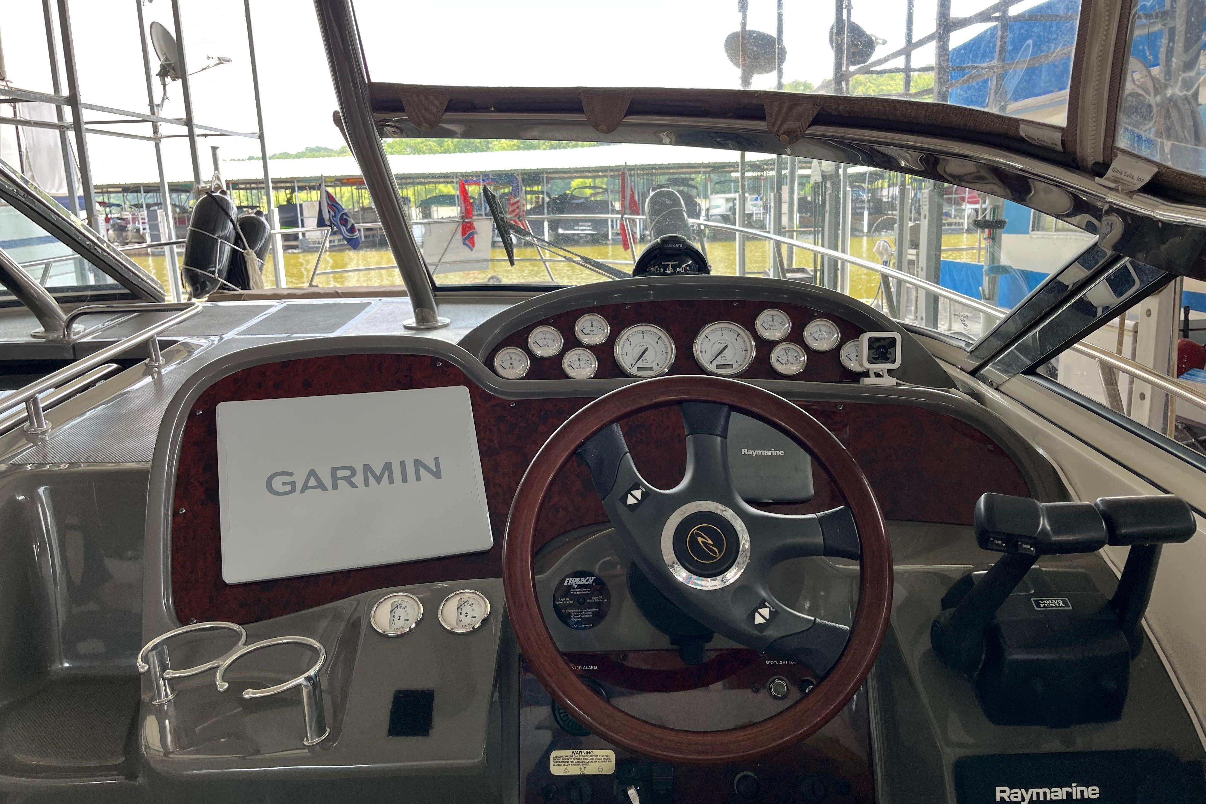 2007 Regal 3760 IB Commodore boat dashboard with Garmin and Raymarine equipment.