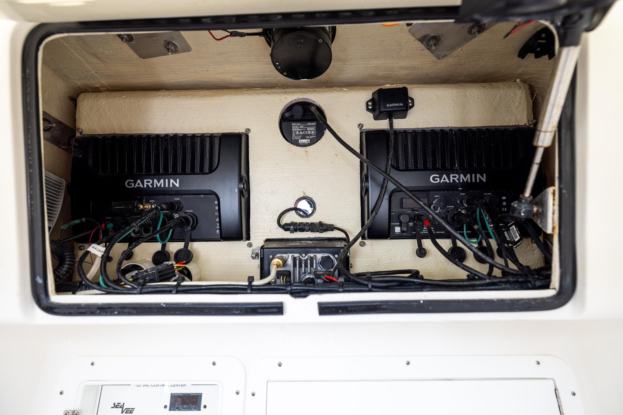 2019 SeaVee 322Z electronics compartment with Garmin devices and wiring.