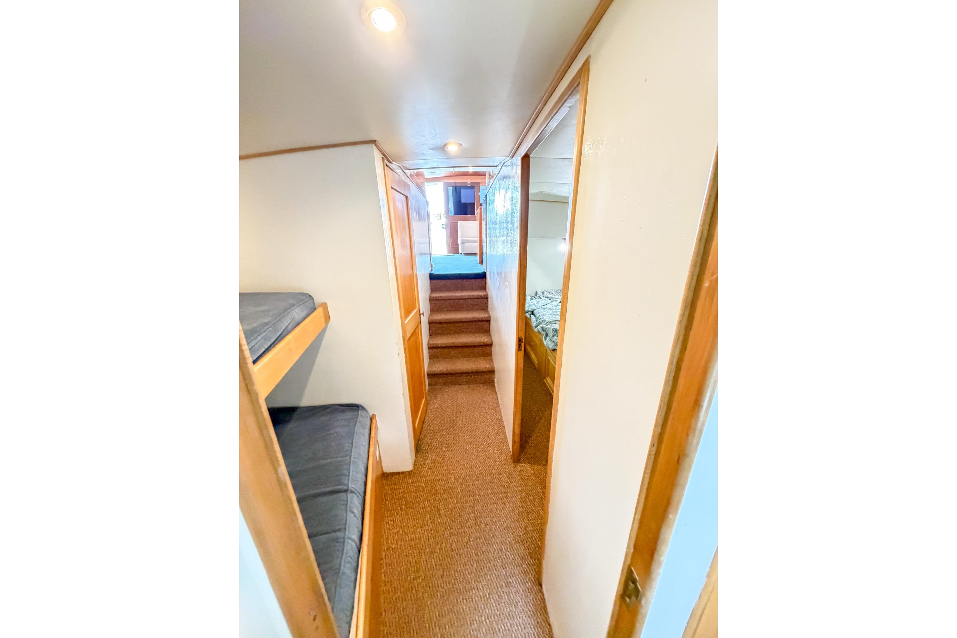 Interior hallway of 1998 Blackwell Custom Carolina Sportfish, featuring bunk beds and cozy design.