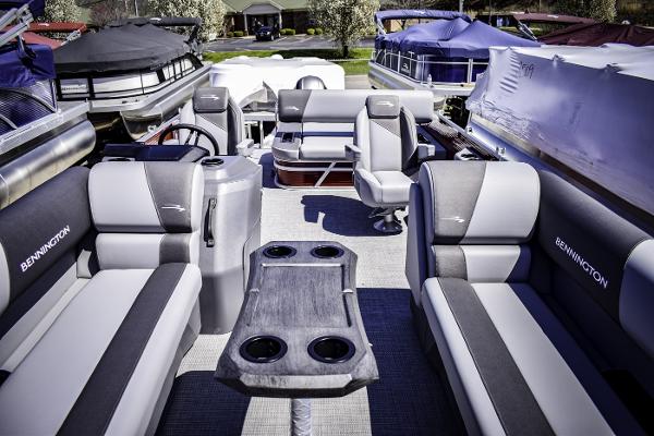 2024 Bennington 22 SVSB pontoon boat interior with plush seating and cup holders.