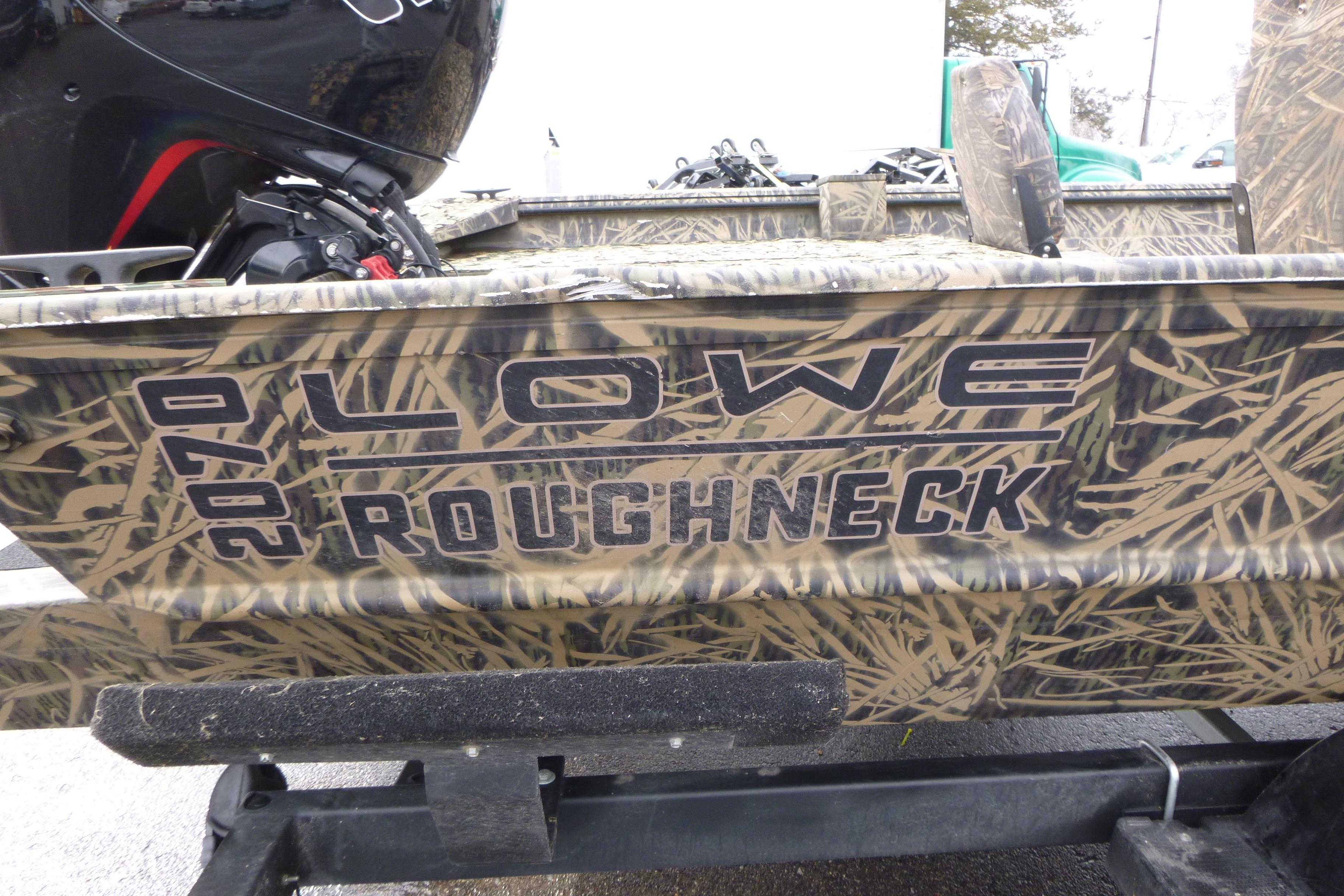 2024 Lowe Roughneck 2070 boat with camouflage design on a trailer.