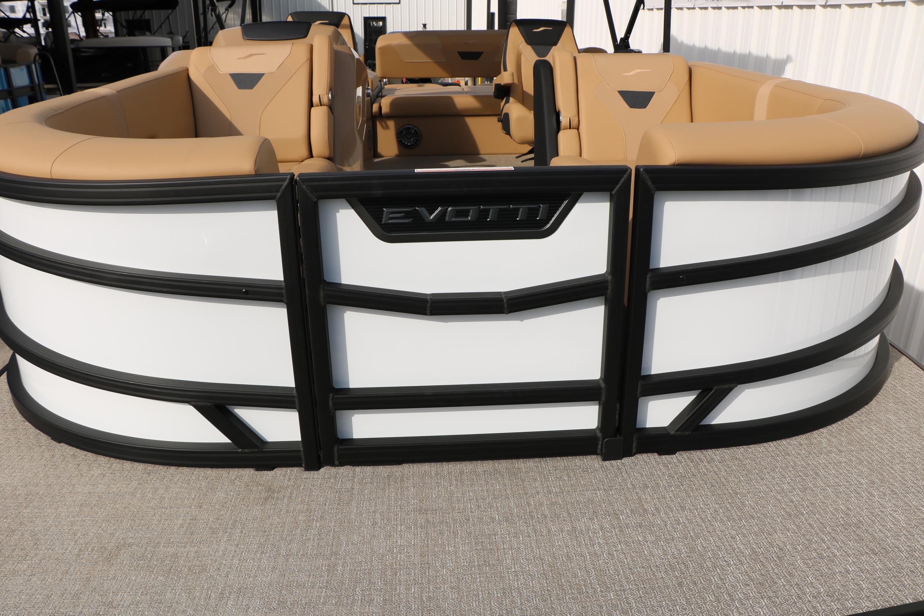 2026 Evotti 523CS pontoon boat with beige seating and sleek black-and-white exterior design.
